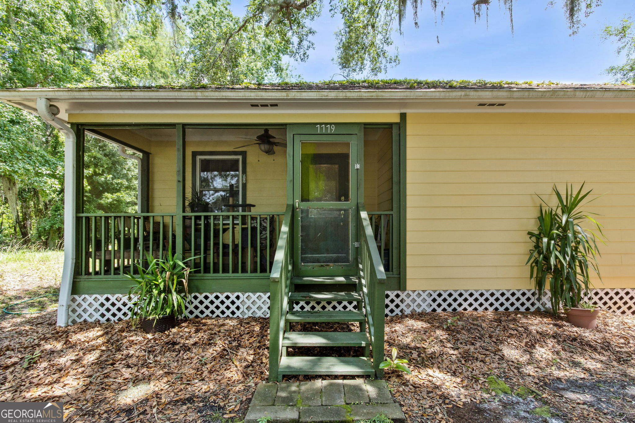 MOVE TO THE BLUFF AND BRING YOUR BOAT! This charming cottage located in historic Harrietts Bluff Village offers privacy as well as close proximity to Crooked River and the Crooked River Boat dock. Home has many extras: Screened porch, fireplace, antique sink in kitchen, Peachtree windows, large trees, storage sheds, walk in closet, large tub,