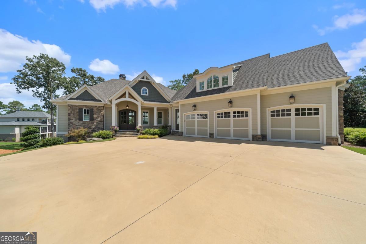 Luxury Lakefront Living. Welcome to 131 Cape View Lane, located in the prestigious private golf club community of Cuscowilla. This custom built home offers breathtaking lake views from nearly every room and feels brand new. Enjoy a saltwater pool and lush professional landscaping (both added within the past year), just steps from your assigned boat slip. This community goes beyond world class golf. Residents also enjoy a community garden, dog park, playground, and even a helicopter pad, setting it apart from the rest. Come experience a lifestyle where every day feels like a vacation in a home filled with thoughtful upgrades and timeless design.