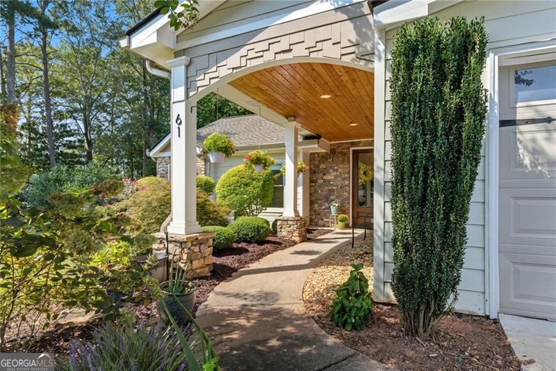 What a gem! This home is a rare step-less ranch in East Cobb! The covered front walkway and beautiful glass front door welcome you into this stunning home. Once inside, you'll immediately fall in love with the dark hardwood floors, soaring 10+ ft. ceilings, and unique archways. The layout flows beautifully and is an entertainer's dream. The oversized Great Room features a gas fireplace, recessed lighting, and two sets of French doors that lead to the Bonus/Flex room and the large, flat fenced-in backyard. The updated, open-concept kitchen overlooks the Great Room and has granite countertops with stainless steel appliances and under-cabinet lighting. Just off the kitchen, you'll find the separate Dining Room. The private Primary Suite features 2 closets and a BRAND NEW bathroom with double vanity and walk-in shower. There are 2 additional bedrooms located down a separate hallway with another BRAND NEW full bathroom and an updated half bath. The home also has a 2-year old roof, new water heater, and loads of other tasteful upgrades. The only thing missing is you! The home is located on an almost half-acre lot with a fully-fenced, level backyard and a long driveway with 2-car garage and additional parking. Don't miss this rare East Cobb beauty!