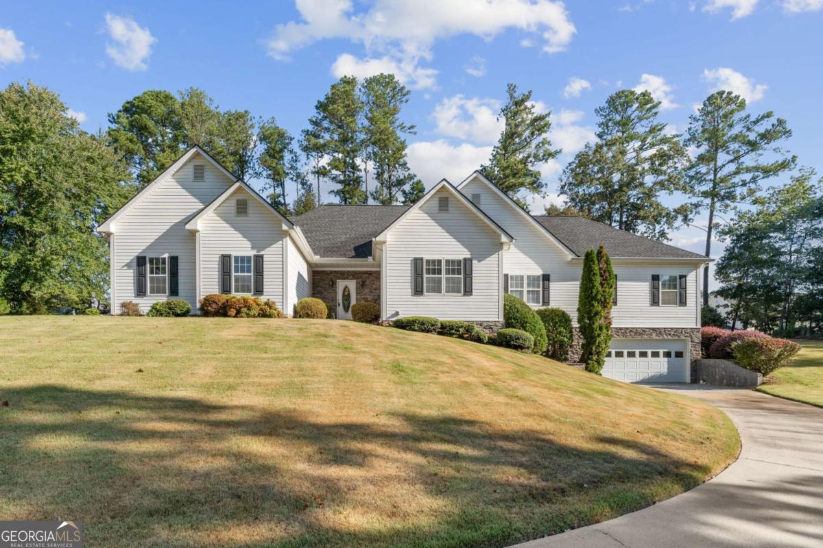 Welcome to your new homestead! This beautiful ranch home sits perfectly on the land. Enter through the gates and be wowed by an acre of Zosia grass! For the car guy, we have 4 garages. For the big family, the terrace level will be the place to hang out. If you are looking for multi-generational living, the terrace level boasts a kitchen, full bathroom, 2 flex rooms and an awesome open concept great room. The main level is so charming, inviting and comfortable! Beautiful white kitchen with granite, stainless steel appliances and hardwoods are overlooking a massive 4 seasons room that just happens to have the best views of the land to enjoy. For a little more subdued area, you have a sunken fireside den. Down the hallway, you'll find the 2 oversized secondary bedrooms and a master suite that is certainly built for the Owner. Beautiful oversized bedroom with a morning room/office attached. Gorgeous master bath with claw foot double vanity cabinet, oversized shower and vertical plank vinyl floors. Just off the master closet is a private entry into the laundry room, which has access from the hallway as well. Imagine walking 5 feet with your laundry?! The home has been so well maintained with a new roof and AC unit in 2019. Effortless vinyl siding makes the upkeep on a home like this so easy. Of course, the all important work shed for a property like this will be staying. All this, and in some of the best schools Cobb County has to offer. One of a kind great house!!!