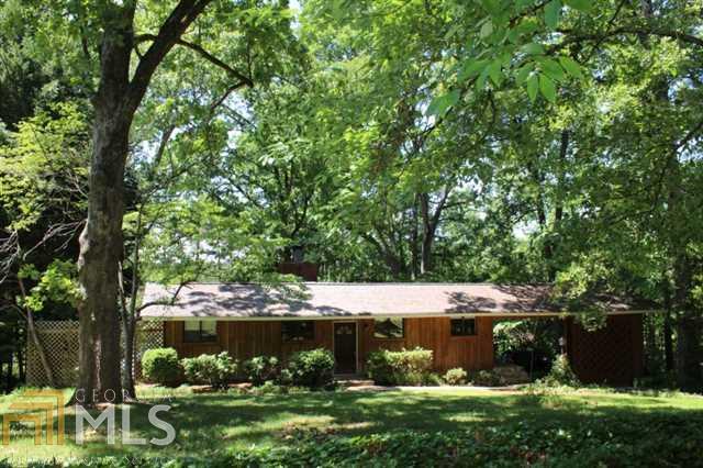 DRASTICALLY REDUCED! LISTED $35K UNDER APPRAISAL. PREMIUM LAKE LANIER DEEP WATER RANCH W/ BASEMENT. NO WAKE WIDE COVE. RENOVATED DECK. UPGRADED GRANITE KITCHEN AND MASTER BATH. OPEN FLOOR PLAN. HARDWOOD FLOORS. SOME CARPET. BASEMENT EITHER HUGE BEDROOM OR BEDROOM/GREAT ROOM COMBO. SCREENED IN PORCH. COVERED 2 SLIP BOAT HOUSE W/ ELECTRIC, BOAT LIFT, AND XTRA WIDE RAMP. AWESOME VIEW AND FLAT WALK TO DOCK. COMPLETE PRIVACY!!!! WELCOME HOME!