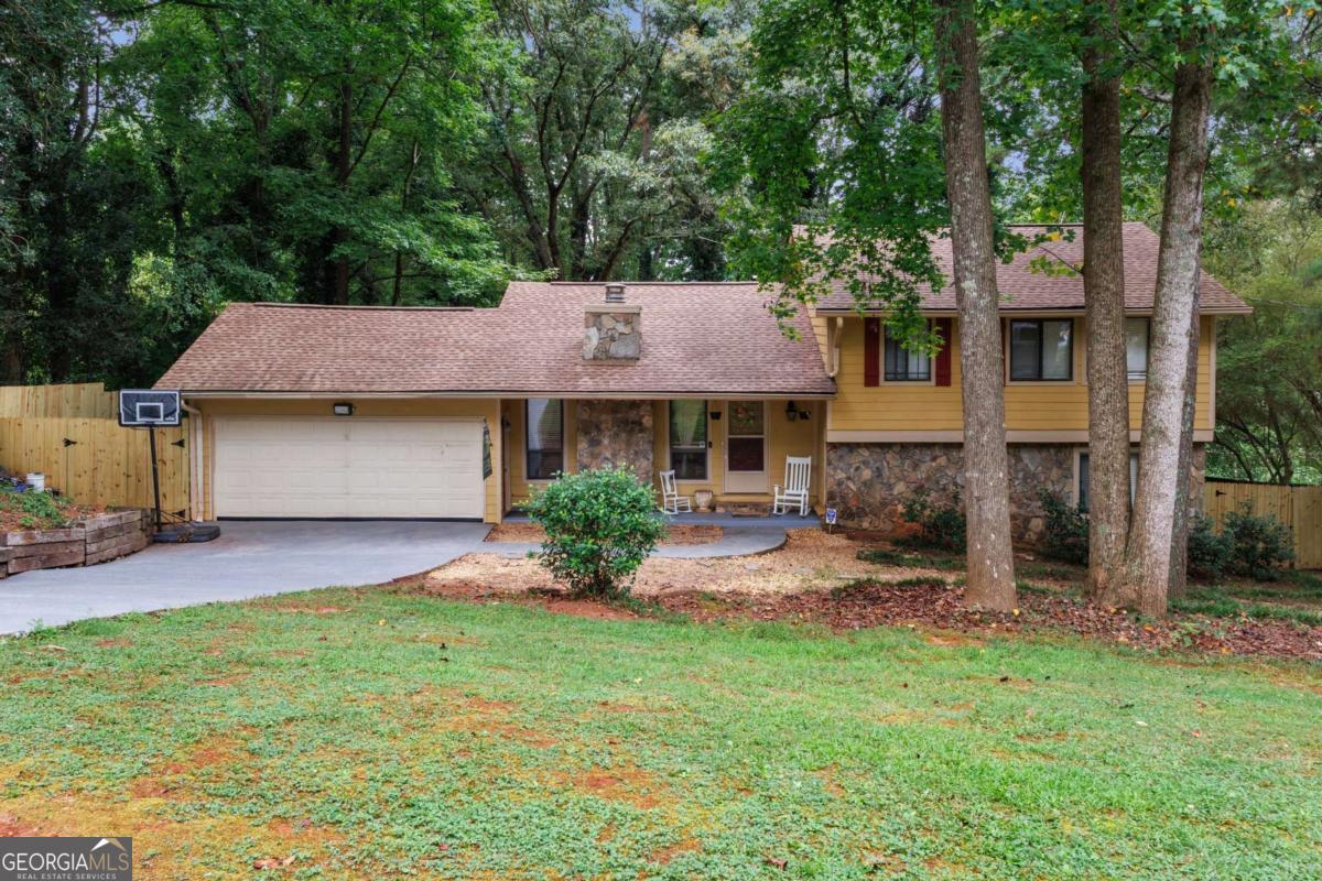 Welcome to your new home! This beautifully maintained gem in the heart of Lilburn offers the perfect blend of space, charm, and functionality. This spacious home features a warm and inviting layout, and a finished lower level complete with an entertainment zone, home office nook, and laundry room. The kitchen boasts generous cabinetry and flows seamlessly into the dining and family rooms. Enjoy the serene porch and rear patio-perfect for morning coffee or evening gatherings. Nestled in a quiet, established neighborhood just minutes from schools, shopping, and dining, this move-in-ready home is perfect for anyone seeking comfort, space, and convenience. Don't miss your chance to make this your forever home-schedule a private tour today!