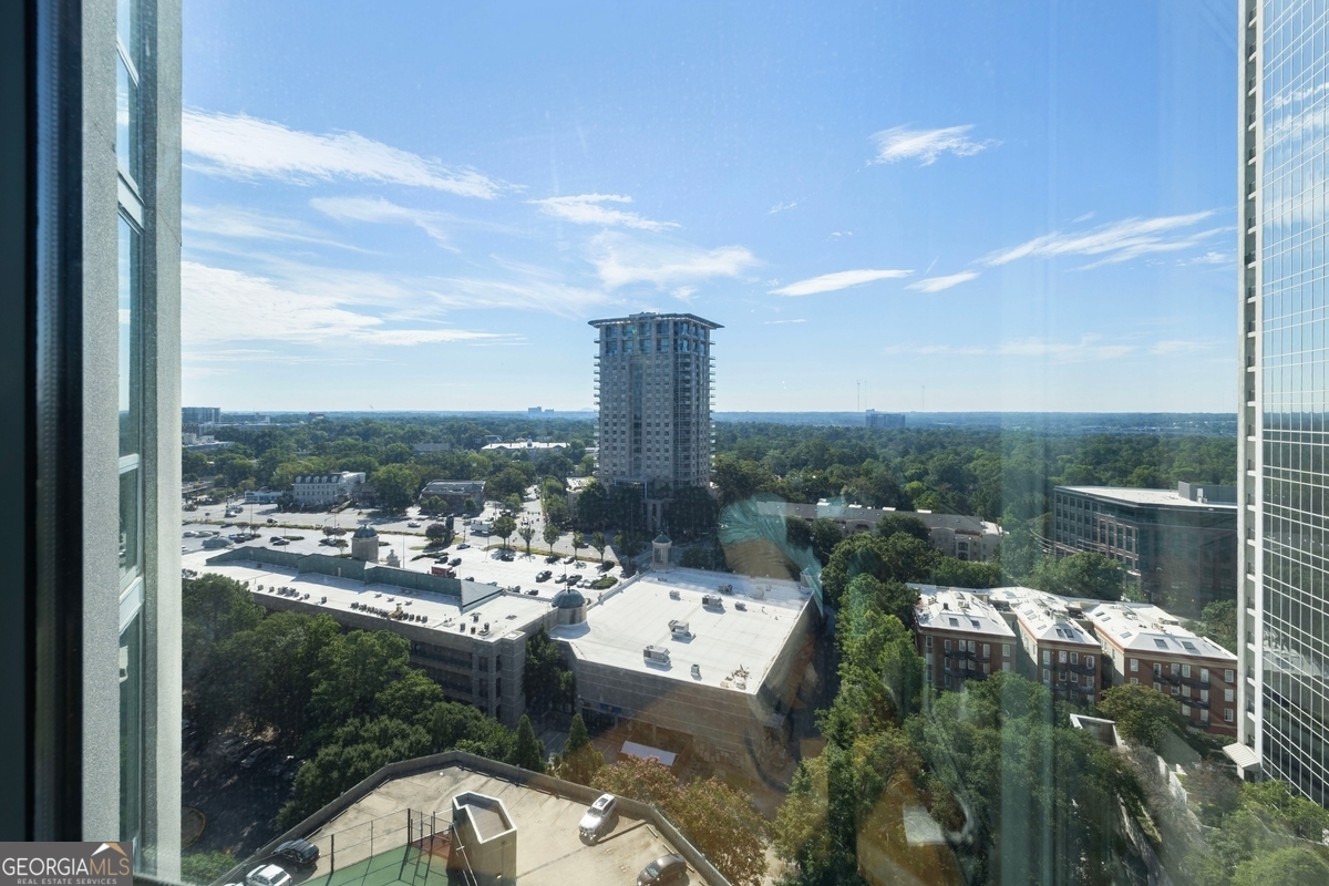 Welcome to Unit 2105 at The Concorde in Atlanta's premier Buckhead Village. This 2-bedroom, 2-bath, 1,228 sqft condo soars above the city on the 21st floor with dramatic floor-to-ceiling windows offering breathtaking views. The unit features updated flooring and modern kitchen appliances, blending comfort and luxury. The Concorde offers a suite of resort-style amenities including a fitness center, pool, tennis court, concierge services, gated garage parking, a dog park, and beautifully landscaped grounds with multi-layered security. Just steps from luxury boutiques, fine dining, and vibrant nightlife, this is high-rise living at its finest.