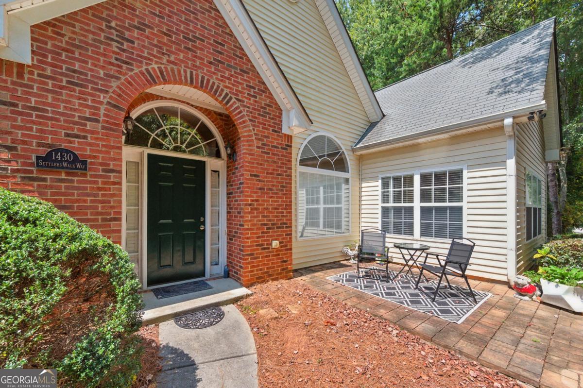 Welcome to this spacious 3 bedroom, 2 bathroom one-level patio home, ideally situated in a quiet part of the neighborhood. Perfect for easy living, the open floor plan features a cozy gas fireplace in the inviting family room, ideal for relaxing evenings. The bright sunroom, with its soaring high ceilings, offers a versatile space perfect for a home office, morning coffee or a reading nook. Step outside to enjoy your private outdoor patio area. The spacious two car garage offer extra space for storage. Neighborhood amenities include a pool, clubhouse, and small exercise area, perfect for staying active and social. Just minutes from the Silver Comet Trail, Hurt Road Park, and a variety of nearby shopping and dining options. This home combines the ease of one-level living with desirable community features and a great location!