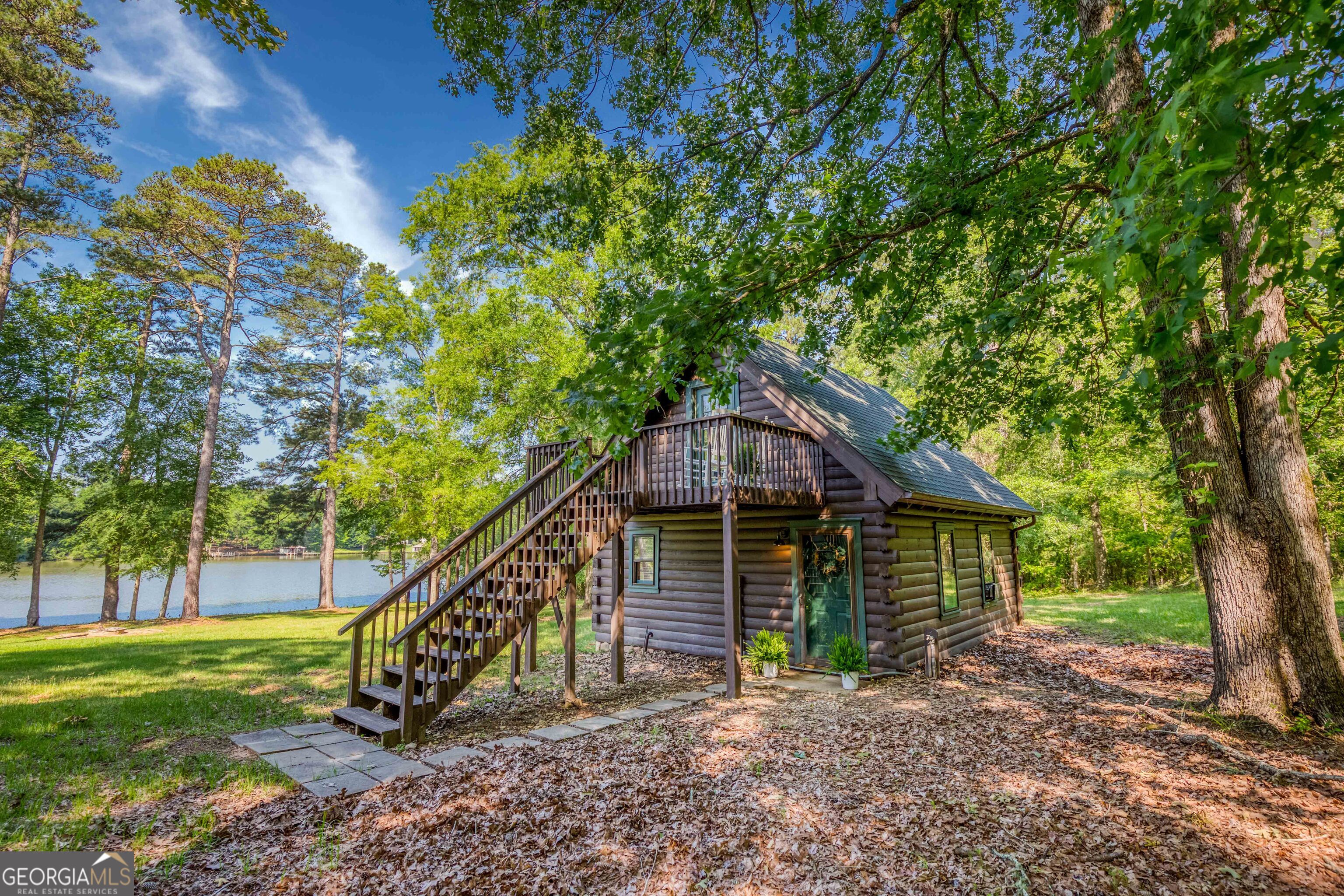 Rare opportunity in Holiday Shores on scenic Lake Sinclair! This charming 1 bed, 1 bath cottage sits on nearly an acre with generous lake frontage-perfect for enjoying the lake lifestyle orbuilding your dream home. The property has been approved for a dock or boathouse, making it ideal for builders, investors, or anyone seeking a peaceful waterfront getaway. Use theexisting home as a cozy guest cottage or live in it while you plan and build. The serene setting, spacious lot, and wide lake views offer endless potential for customization and expansion.Whether you're envisioning a weekend escape or a full-time lakefront retreat, this property delivers the space, location, and flexibility to make it your own. Don't miss this chance to ownlakefront property with room to grow in one of Lake Sinclair's most sought-after communities!