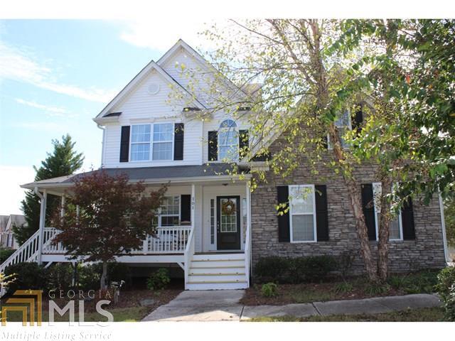 JUST LISTED! Former model home. Stunning 3-level open floor plan w/ front porch and covered rear deck w/ professional landscaped level yard and fenced. Great room features fireplace, hardwood floors; opens to the large kitchen w/ island, beautiful cabinetry & hardwoods. Upper floor features Master bedroom w/ trey ceiling & large sitting room. Spa-like master bath has whirlpool tub, separate shower, double vanity & large walk-in closet. Secondary rooms w/ full bath completes upper floor. Finished terrace level with large bedroom/family area combo w/ full bath & storage.