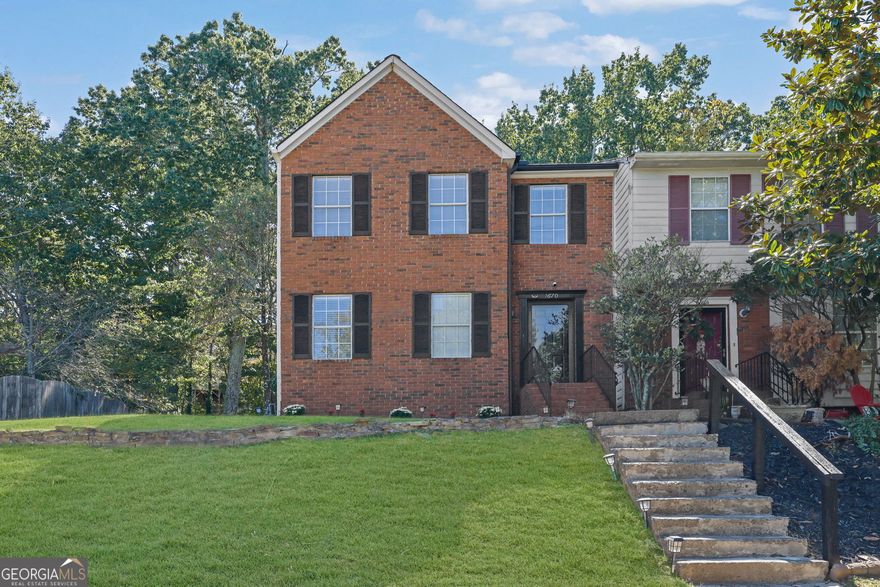 Location, Location!    Looking for a peaceful place to call home while staying close to everything your heart desires? Look no further! This beautiful, and well maintained end-unit townhome offers the perfect blend of comfort, convenience, and charm, with no HOA. Shared wall with one neighbor, as a cluster of only  two houses.    Ideally situated near Kroger and Publix shopping centers, Starbucks, a variety of restaurants, parks, and nature centers-this home puts everything you need right at your fingertips.    Filled with natural light and featuring laminate flooring throughout, this residence exudes warmth and style. The spacious primary bedroom is bright and inviting, while the secondary bedroom across the hall, complete with its own bathroom, provides privacy and comfort for family, guests, or even a home office.    As you enter through the north-facing front door, you're greeted by a welcoming foyer that opens to the kitchen with beautiful granite countertops, and breakfast area on your left-a perfect spot to start your day. The charming kitchen with stainless steel appliances, is ready to inspire your inner baker, filling the home with the comforting aroma of fresh cookies.    The living room, with its cozy gas fireplace, seamlessly connects to the dining area, creating an open and inviting space for gatherings, game nights, and memories in the making. Step outside to a spacious deck and large backyard with a shed, where you can enjoy a peaceful morning coffee or tea while taking in the sights and sounds of nature.      Come and experience this lovely home for yourself-where comfort, convenience, and serenity meet.  Some pictures have been virtually staged.