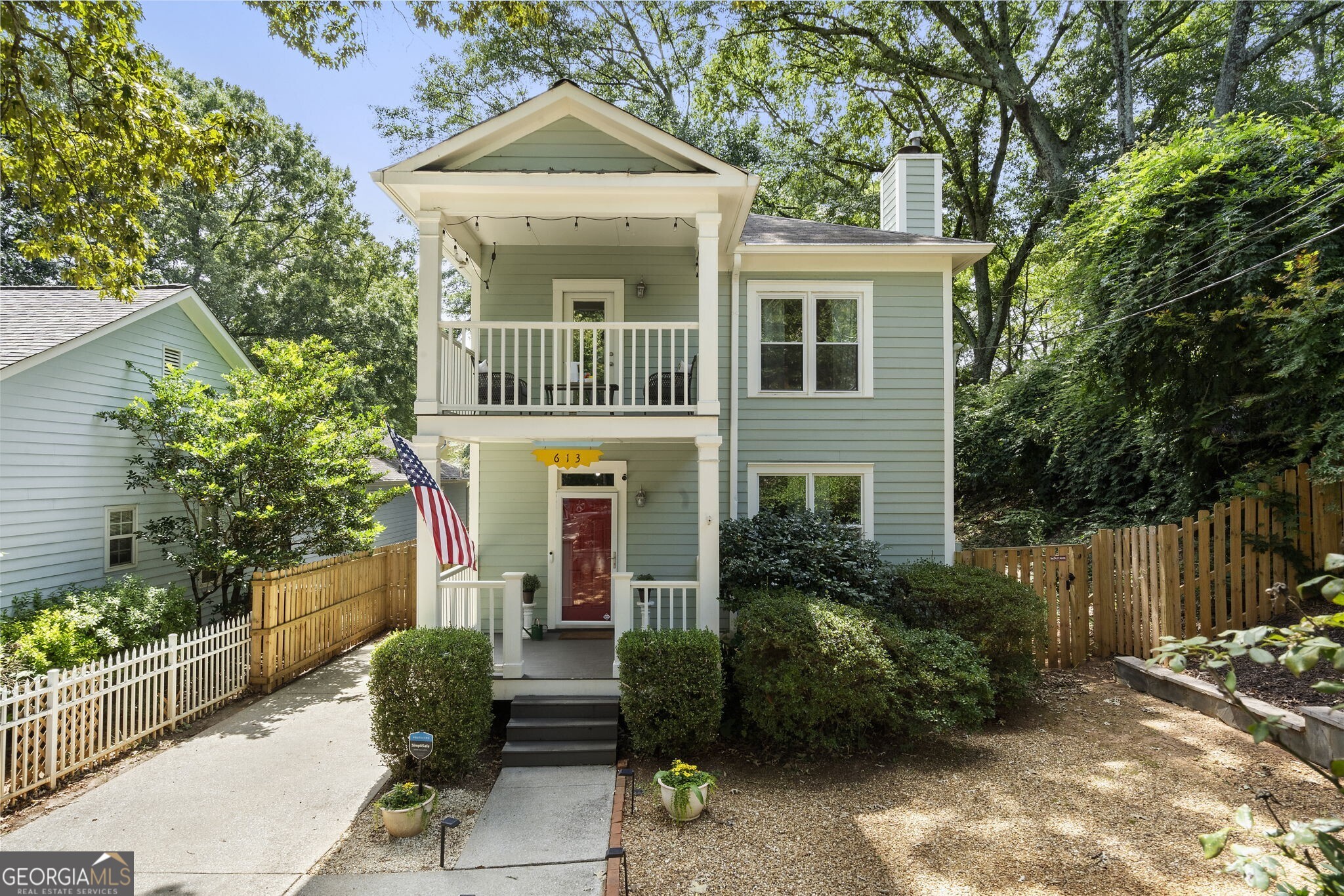 Absolutely precious home tucked into a hidden street in the heart of Grant Park steps from the most charming park in Atlanta and the Beltline! Stroll down the sidewalks to this pristine home with great curb appeal. Gleaming hardwoods throughout with open concept and perfect flow. An inviting fireside family room open to dining room. Cute eat-in kitchen opens to deck and walk out backyard, perfect for entertaining. All bedrooms up with laundry and primary suite with it's own porch and double vanity. Tons of windows let so much natural light fill this home! Move right in and enjoy all the restaurants and activities this special neighborhood has to offer!