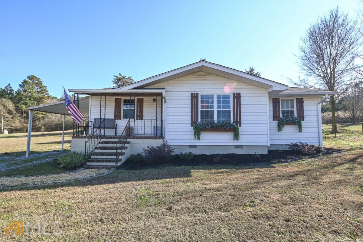 Don't miss this recently renovated 3-bedroom, 1-bath house situated on just a little over 2 acres in Madison County. The house has beautiful hardwood floors throughout that have been sanded and restained. The kitchen has been fully renovated and features new cabinets and countertops. Additional updates include bathroom, electrical panel with new wiring throughout, new plumbing, and new central heat and air. Outdoors you will find a covered porch and fenced in back yard.