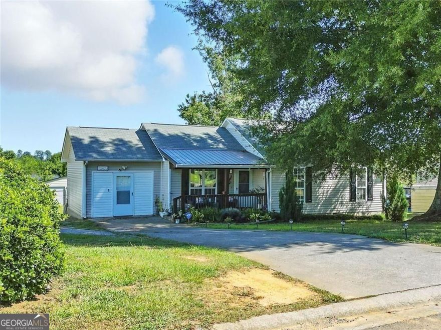 Get a 1/0 lender paid buy down for the first year using our preferred lender! Finally-yard space, a workshop, and a move-in ready ranch that won't break the budget. This one checks the boxes with a fenced half-acre lot, practical updates, and plenty of flexibility inside and out.  Step inside to easy-care tile and plank flooring, a light-filled living area, and a kitchen with refreshed painted cabinets, stone-look countertops, and stainless steel appliances. The layout keeps things practical with everything on one level-including three full bedrooms and two full bathrooms.  The primary suite offers privacy on one end of the home, complete with updated flooring and soft natural light. Two additional bedrooms sit on the other side of the hall, with a shared hall bath just steps away.  Out back, the fully fenced yard opens up wide and level-ready for dogs, gardening, backyard games, or just a quiet evening by the firepit. The separate workshop offers room for storage, hobbies, or weekend projects. There's even space to add more.  A low-maintenance exterior allows you get more time enjoying the space and less time taking care of it.