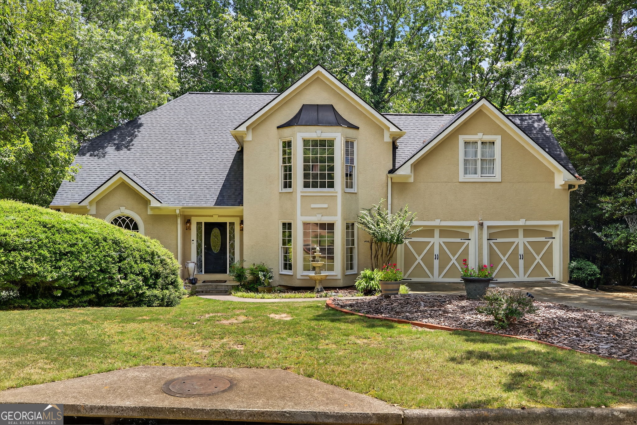 Stunning Executive Home with Finished Basement & Backyard Oasis! Welcome to your dream home! Tucked away on a private lot, this 5-bedroom, 4-bath custom home is the perfect blend of classic charm and modern sophistication. From the moment you pull into the driveway, you'll fall in love with its stately curb appeal, elegant architectural details, and beautiful manicured landscaping complete with a charming fountain centerpiece and carriage-style garage doors. Step inside to soaring ceilings, tons of natural lighting, and timeless hardwood floors. The chef's kitchen is complete with granite countertops, a large center island, gas cooktop, and a wall of built-in cabinetry perfect for entertaining or everyday living. The luxurious owner's suite features a spa-like bathroom with a frameless glass shower, soaking tub, dual vanities, and custom tilework throughout. Need space for guests or hobbies? You'll love the fully finished basement! Completely renovated a couple years ago it offers a home theater, billiards/game room, and custom wet bar-the ultimate hangout zone! Outdoors, enjoy peaceful mornings or weekend BBQs in your private backyard retreat, shaded by mature trees and full of potential for gardening, play, or relaxation. Highlights Include: Finished basement with game room, bar and pool table! Vaulted ceilings & abundant natural light Designer kitchen & bathrooms Double garage with carriage doors Prime location, plenty of space, low HOA fees and