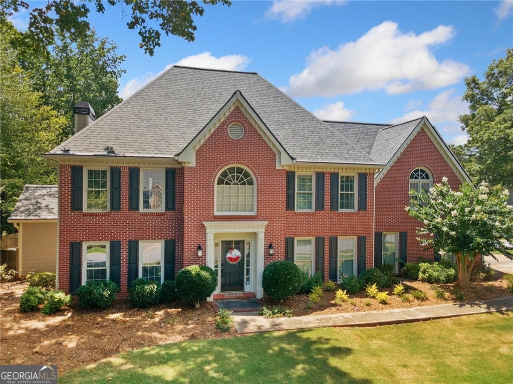 Live the American dream in a neighborhood where everybody knows your name, greets you with a smile, kids meet at playgrounds, pools, ride bikes in the streets and a clubhouse and country club to spend with family and friends. This traditional home is nestled in the heart of it all on a corner lot, 3 car garage. Third garage is on the far side of the house. fenced in backyard with all-weather sun room, and gorgeous landscape for a private oasis to enjoy. Step inside to timeless finishes and a welcoming floor plan. This home was built to enjoy quiet family time to holiday parties. Open concept kitchen w/ panoramic views to back yard, sun room, and living room, separate dining and private office all on the comfort of the main floor. Upstairs you will find a private owners retreat, flax space for anything you choose and generous-sized secondary bedrooms. This home is everything charming and cozy. In the heart of all things West Cobb where schools are sought after where local cuisine and small owned business and enjoyed and loved.