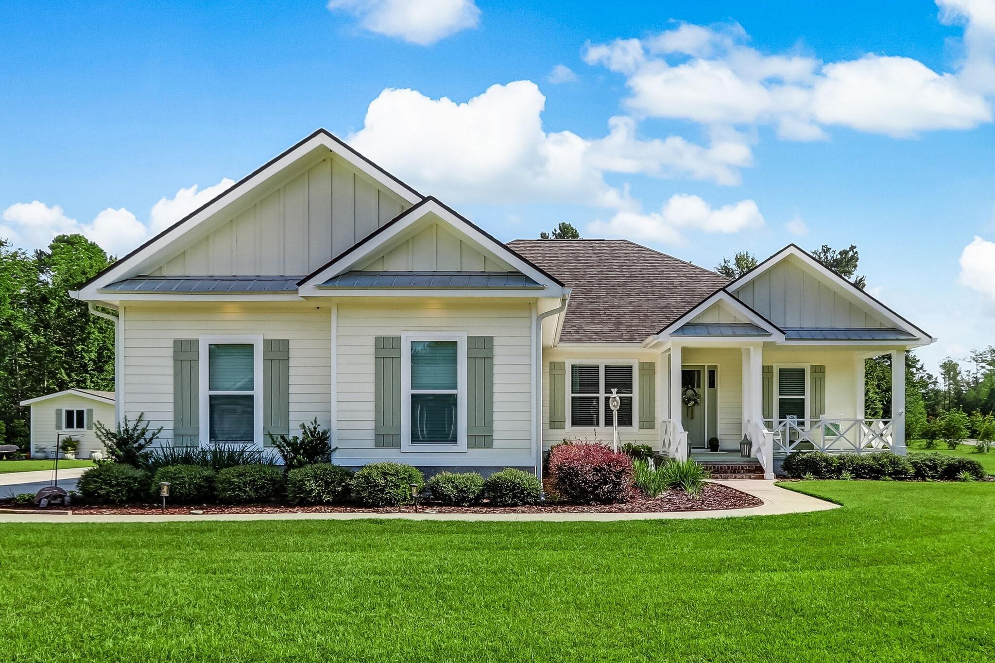 SELLER'S OFFERING ONE YEAR HOME WARRANTY UP TO $700.00. DON'T MISS OUT ON THIS 2018 CUSTOM BUILT HOME IN THE LANDINGS AT CATFISH CREEK NO HOA 2230 SQ. FT 4 BEDROOMS, 2 BATHROOMS, MASTER BATH DOUBLE VANITY W/ DUAL SHOWER HEADS, LARGE WALKIN CLOSET. 10 FT CEILINGS & CROWN MOLDING THROUGHOUT, 5 1/4 BASEBOARDS, HARDWOOD FLOORS & TILE IN WET AREAS, TRAY CEILINGS, 12 FT. KITCHEN ISLAND, BREAKFAST NOOK, WALK-IN PANTRY, STAINLESS STEEL APPLIANCE. OVERSIZE 2 CAR GARAGE & WALK UP STAIRS TO ATTIC W/SPRAY FOAMED AND FLOOR INSULATED CAN CONVERT FOR BONUS ROOM. INTERIOR WALLS ARE INSULATED TO HELP SOUND PROOFING. LED LIGHTING IN COMPLETE HOUSE, SCREENED IN LANI, 400 AMP SERVICE(200 FOR HOUSE/200 FOR GARAGE. SHED FOR LAWN MOWER & WELL PUMP HOUSE. 30X40 WORK SHOP W/110V AND 220V, CAR LIFT W/ 5HP 80 GALLON TANK COMPRESSOR, SHOP COMPLETE SPRAY FOAM. RV PARKING IN REAR W/50 AMP SERVICE, 30 AMP SERVICE FRONT OF SHOP FOR SMALLER RV. ROOM ENOUGH FOR ADDITIONAL INLAW HOME. GARAGE CAN ACCEPT RAMP FOR HANDICAP, PARTIAL ADA COMPLIANT. NIGHT LIGHTS UNDER BATHROOM CABINETS. HOUSE IS LOCATED 2 MILES FROM THE FLORIDA LINE AND 14 MILES FROM JAX AIRPORT.