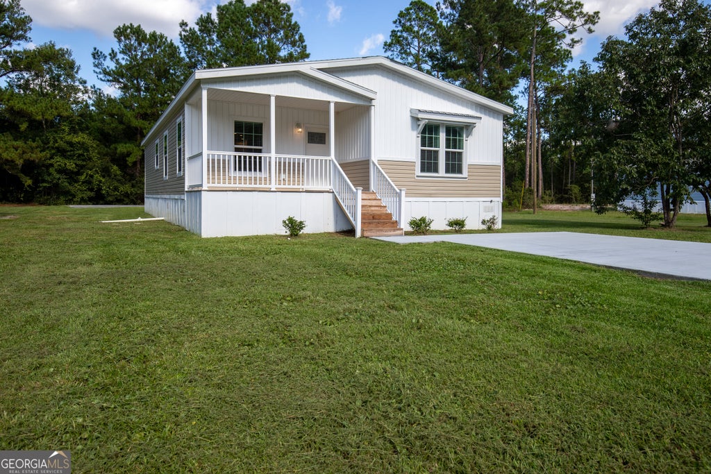 Photo of 660 N Macon Street, Ludowici, GA 31316 (MLS # 10850502)