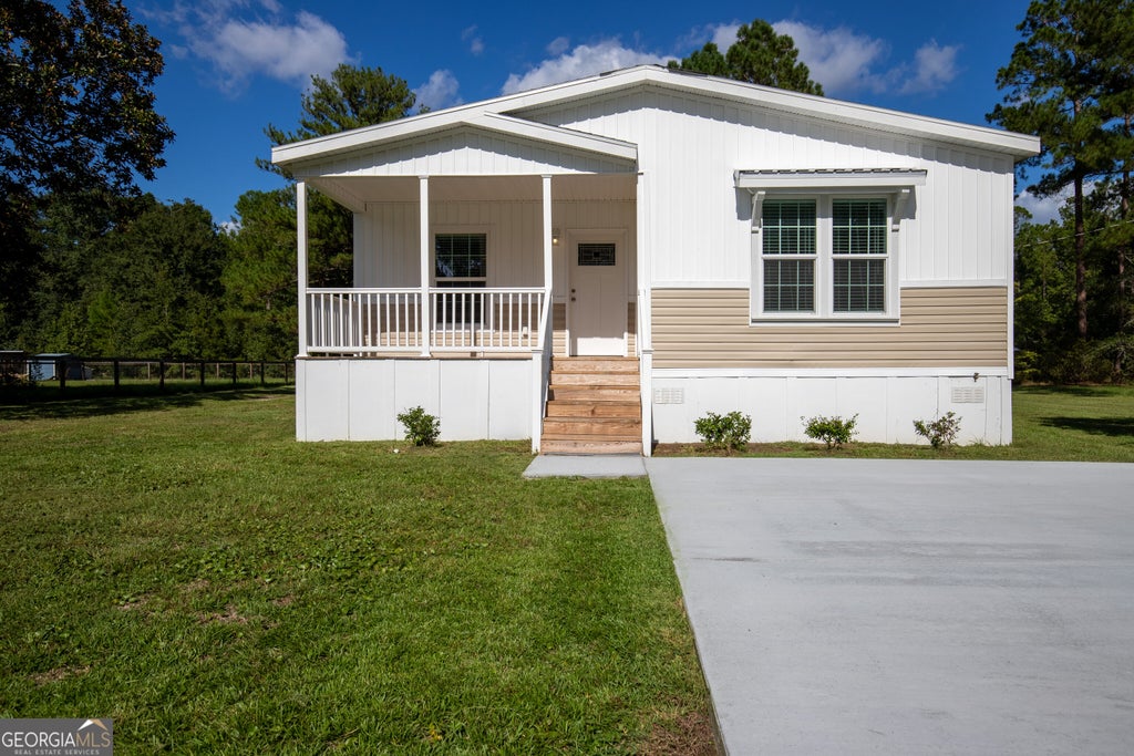 Photo of 660 N Macon Street, Ludowici, GA 31316 (MLS # 10850502)