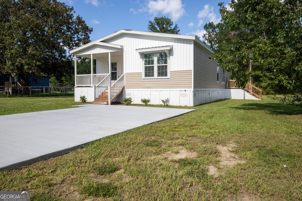 Photo of 660 N Macon Street, Ludowici, GA 31316 (MLS # 10850502)