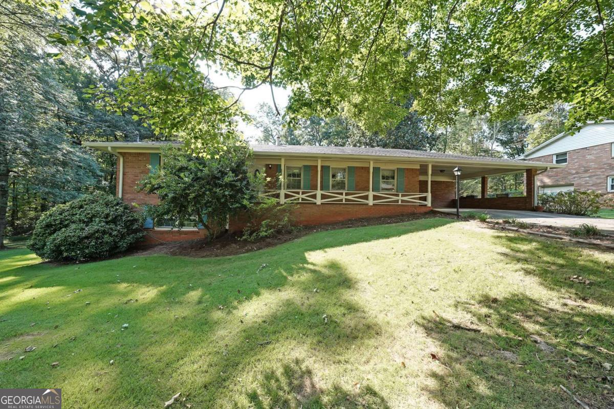 Move-in ready, 4-sided brick ranch with 3 bedrooms, 2 baths, and a full basement with a finished room. Enjoy a screened back porch, fenced yard, new luxury vinyl tile, fresh paint, and updated kitchen countertops and sink. Large 1 acre double corner lot. Great location near all needed amenities.