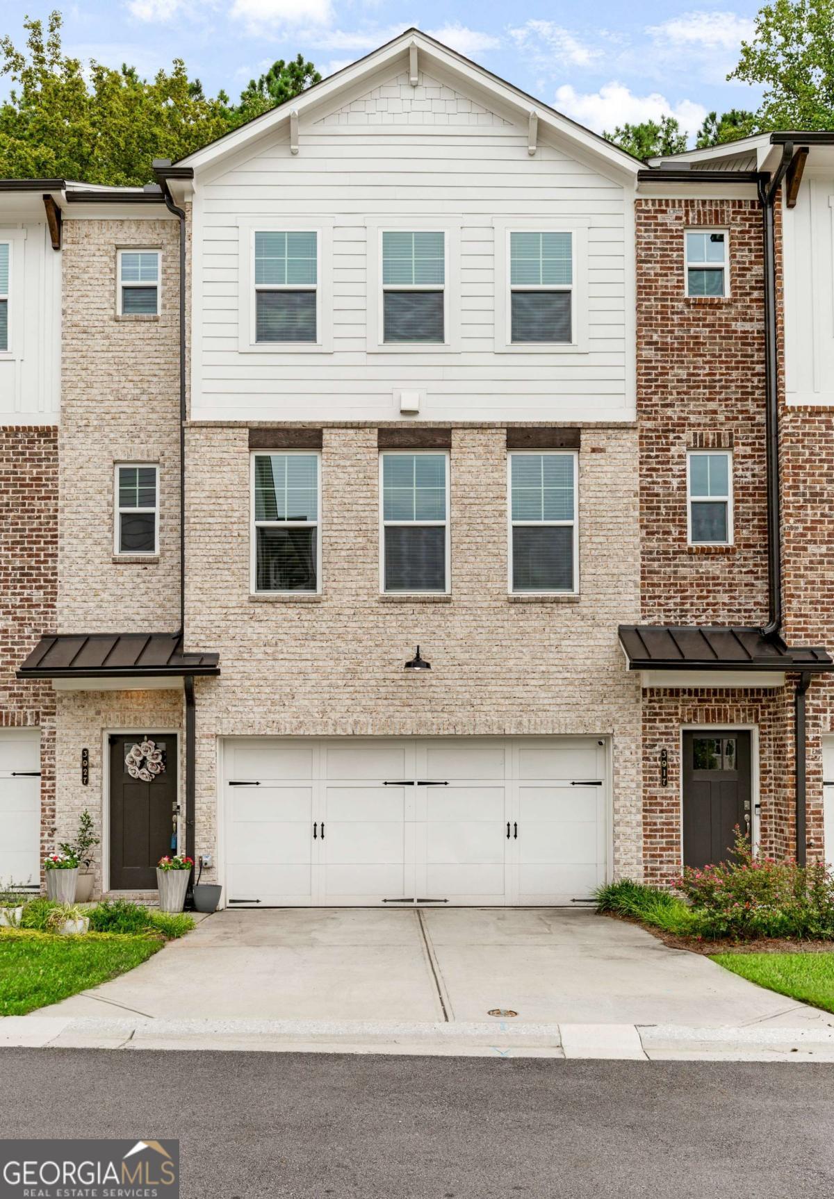 Just an amazing location, snuggled between some of Atlanta's most popular shopping and dining areas, you are less than 20 minutes from The Forum, Downtown Roswell, Downtown Alpharetta, Dunwoody Village and Perimeter Mall and The Avalon! This all-brick townhome not only offers style but super spacious and comfortable. Main level boasts hardwood plank flooring throughout, a cozy stone fireplace, and separate dining area. The kitchen is in the center highlighted by a huge island kitchen, stone counters, gas cooktop stove, stainless steel appliance package, double ovens and custom white cabinetry. Top floor is host to three bedrooms. The owner's suite has spa like master bath with soaking tub, separate glassed-in shower and double vanities with stone counter tops. The bottom floor is and open bedroom/flex space with full bath and could be great area for guest bedroom or basement/rec space.
