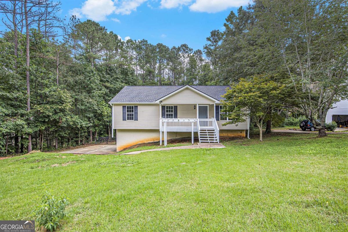 Perfect Starter Home in Carrollton - Move-In Ready! Fall in love with this charming 3 bedroom, 2 full bath ranch on a basement, perfectly priced and ready for its new owners! Boasting brand new carpet, gleaming new stainless steel appliances, fresh fixtures, and a freshly painted interior, this home checks all the boxes for style and comfort. Enjoy the airy open concept living-to-dining room with durable LVP floors, a bright dining area with a deck view, and plenty of space to entertain. Step outside to your brand new deck overlooking a large backyard - perfect for summer barbecues, pets, or playtime. The spacious front yard adds even more curb appeal, and the no-HOA neighborhood means more freedom for you! With a full basement for storage or future expansion and updates throughout, this home is truly move-in ready. Don't miss your chance to own this gem in Carrollton - affordable, updated, and priced to sell!