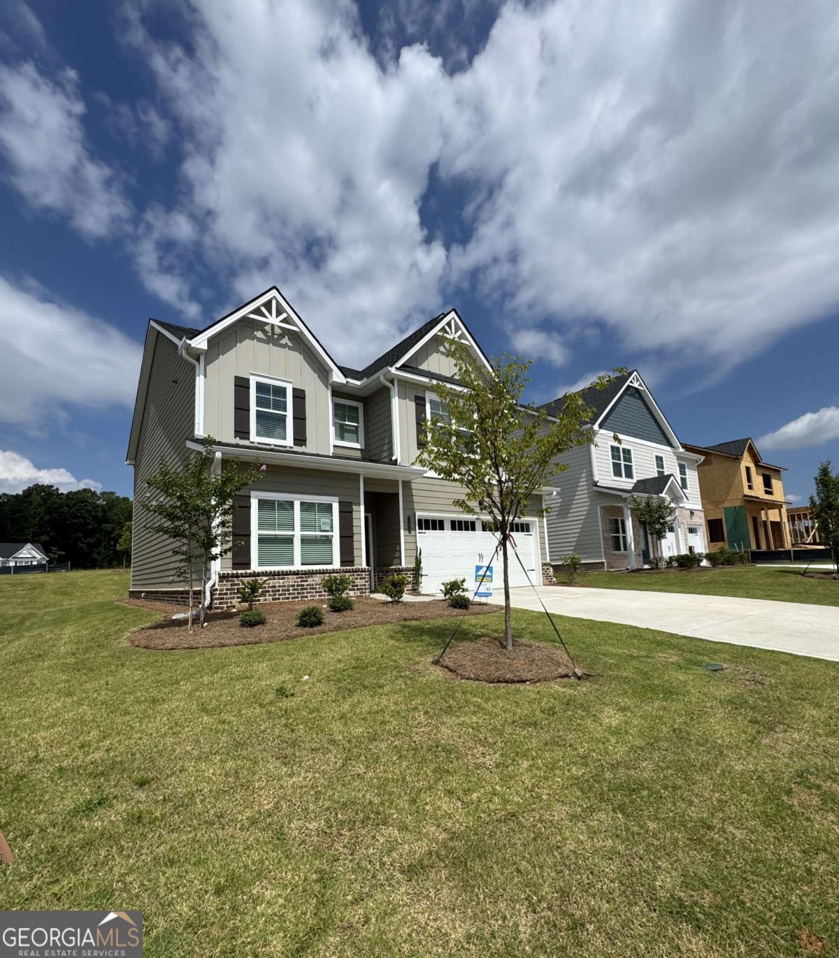 Step into this beautiful brand new construction, featuring 5 bedrooms and 3.5 bathrooms. The perfect blend of space and style with unlimited decor opportunities. Energy efficient LED lighting throughout! The foyer entrance leads to a spacious family room setting with an electric fireplace that gives great aesthetic, along with coziness and comfort. A modern galley style kitchen offers inviting light, a breakfast eating area, an extended island bar with under-mount stainless steel sink, granite countertops, stainless steel appliances, pantry and plenty of cabinet space. An adjacent formal dining room is great for hosting special occasions, and creating lasting memories. The upper level has over-sized secondary bedrooms with walk in closets and are located near a full bathroom with dual vanity. The Owner's suite offers a perfect blend of space that's complete with a luxurious bath with separate shower, glass shower door and separate tub with tile surround for the ultimate relaxation experience. Laundry room is conveniently located on the upper level. Minutes from downtown Covington Square.
