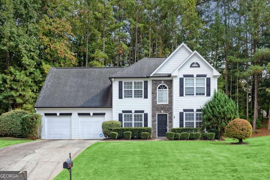 Traditional, move-in ready home situated on a cul-de-sac lot in popular Milford Woods swim/tennis community! New flooring & fresh paint. Grand two-story foyer welcomes you to separate dining & living room. Spacious kitchen featuring granite & eat-in area opens to impressive two-story great room with gas-log fireplace, perfect for gathering. Laundry room on main directly from the garage can double as a mudroom. Oversized primary bedroom offers additional space ideal for a sitting area, office, or nursery. The primary bathroom offers double vanity, separate tub & shower & spacious walk-in closet. Additionally upstairs you'll be delighted with two spacious secondary bedrooms & full bath. Enjoy relaxing on the patio overlooking the private, wooded backyard. Conveniently located to EW Connector/Barrett Parkway/Windy Hill, Silver Comet Trail & Wellstar Cobb.