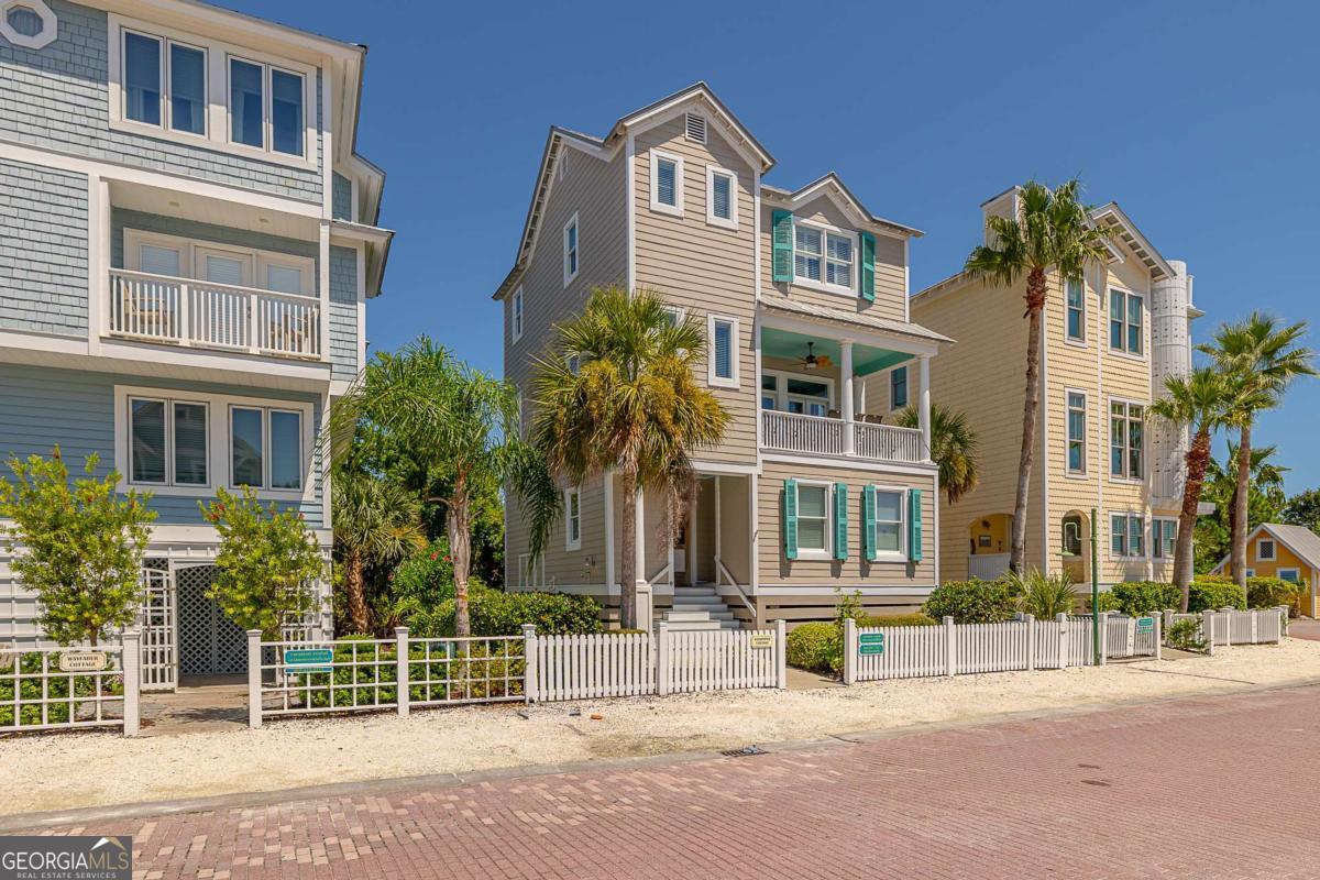 Ocean Views, Beachside Bliss, and Coastal Charm! Ocean Views, Beach Adjacent, Charming and Darling-what more can one ask for!! Experience the best of island living in this stunning 3-bedroom, 3.5-bath residence designed for comfort, convenience, and camaraderie. Spanning three floors and complete with a private elevator, this home offers seamless access to every level. On the first floor you'll find 2 bedrooms each with an ensuite bath, sold completely furnished The second floor is the primary living area, and it is the stuff island dreams are made of. Featuring an open kitchen, dining and living room with abundant natural light. Breathtaking views from the front porch (feel the ocean breeze and catch a glimpse of the waves from an ideal vantage point), where you can have a morning coffee or a relaxing evening enjoying a beautiful sunset and a cocktail. Completely dedicated to the primary suite, the 3rd floor there is amble room for a private office space with water views. There is also a private balcony for those late nights. Located in Coast Cottages at Saint Simons a great community, with 2 community pools and within 100 yards from the sand and you'll have your toes in the ocean within minutes. This home also has a successful rental history through VRBO and Airbnb! Just 5 minutes away, you'll find the vibrant St. Simons Village, home to local favorites like Brogen's, The Half Shell, Georgia Sea Grill, plus charming shops, bars, and boutiques. Whether you're seeking a full-time residence or a coastal getaway, this home blends modern amenities with the relaxed charm of Saint Simons Island.
