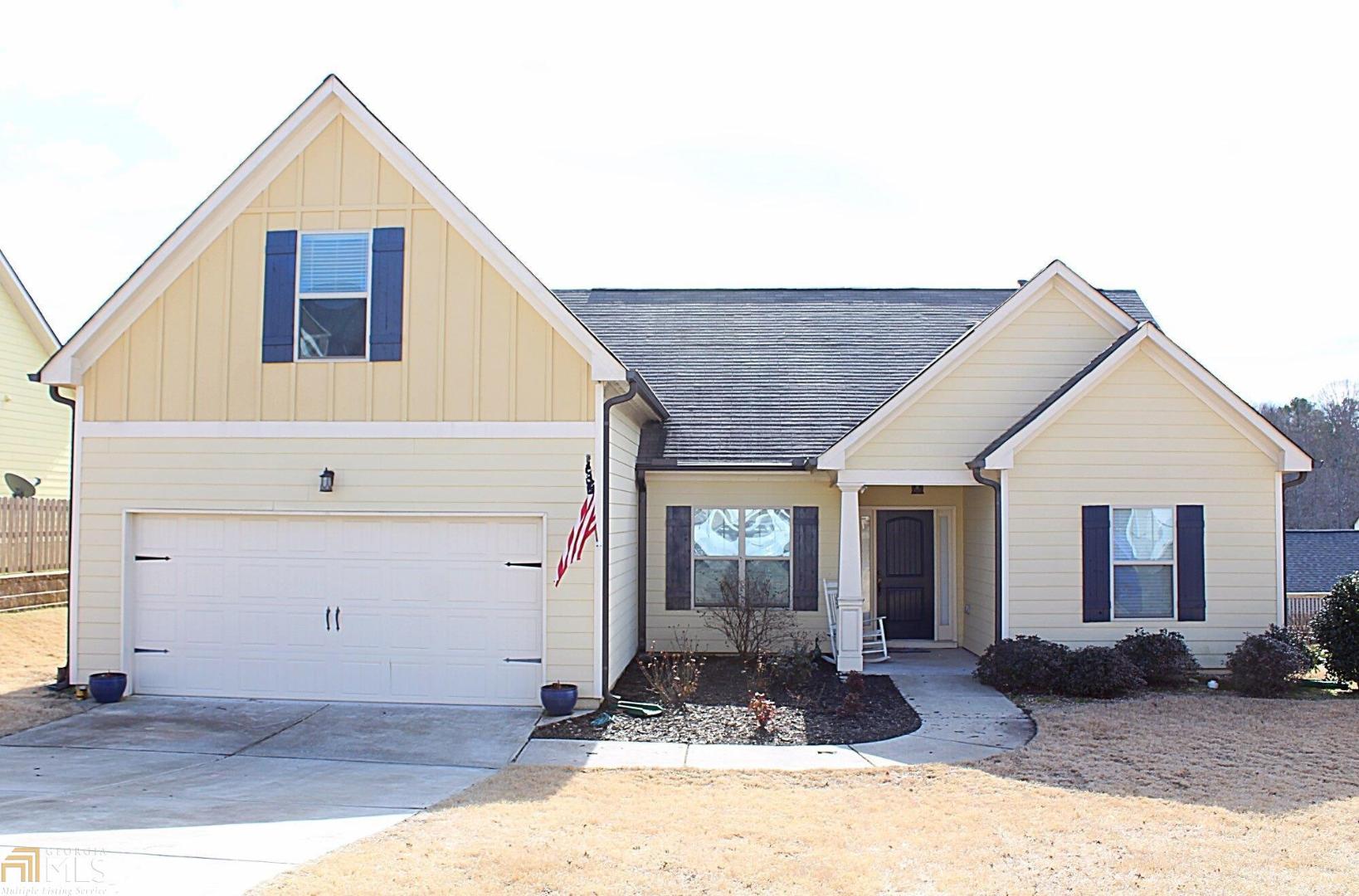 Beautifully maintained craftsman style 3/2 ranch with upstairs 4th bedroom. Open floorplan, great for entertaining! Kitchen has all stainless appliances, mocha cabinets and granite countertops. Breakfast room and separate dining room. Split bedroom floorplan. Large front yard and level lot. Within walking distance to downtown Dawsonville. Possible 100% financing through USDA.