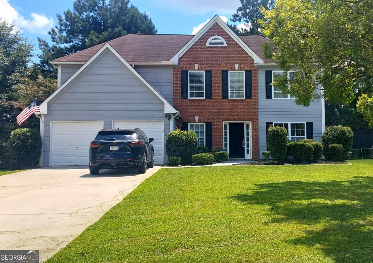 Step into the perfect blend of space, comfort, and style in this stunning 4-bedroom, 2.5-bath home, beautifully situated on a desirable corner lot in the established Magnolia Walk subdivision. Nestled on just over a third of an acre, this 2,734 sq ft residence offers inviting curb appeal and a thoughtful layout ideal for everyday living and entertaining. Inside, you'll find a formal dining rm & formal living rm, perfect for hosting guests, alongside an eat-in kitchen brimming with cabinetry, a separate pantry, and stainless steel appliances, all overlooking a warm and welcoming fireside den. Upstairs, the magnificent primary suite is a true retreat, featuring a cozy fireplace, a separate sitting room, and a spa-like bath with a soaking tub, separate shower, and dual vanity, plus a roomy walk-in closet. Three additional spacious bedrooms and a conveniently located upstairs laundry room complete the second level. Addl highlights include an attached 2-car garage, a rear concrete patio for outdoor gatherings, and a prime location near shopping, dining, and major routes. Don't miss the chance to tour this exceptional home, it's ready to impress and waiting for your offer!