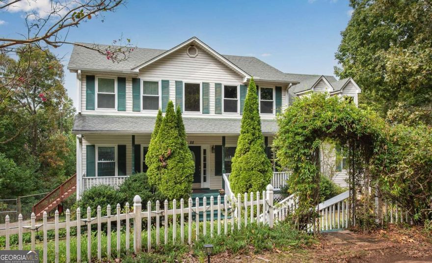 Welcome to your own private retreat! No HOA - Less Than 15 Minutes to Downtown Jasper! This charming home sits on 5 beautiful acres and even includes lake frontage on a small lake. Enjoy the rocking chair front porch, circular driveway perfect for guests, and a fenced backyard for added comfort.  Inside, the main floor features a private office, formal dining room, spacious family room with a cozy stone fireplace, and a bright eat-in kitchen that overlooks the family room. There's also a HUGE great room/playroom, laundry on main, and a half bath complete the main level.    Upstairs you'll find 4 bedrooms and 2 full baths, offering plenty of space for everyone. The home also includes drive-under main garage with 2 doors.    Recent updates include new insulation in the garage and all updated windows within the past few years as well as New Back Deck Doors. Best of all - this property qualifies for USDA 100% financing.    No HOA, total privacy, and room to spread out... yet just minutes to downtown Jasper. This is the lifestyle you've been waiting for!