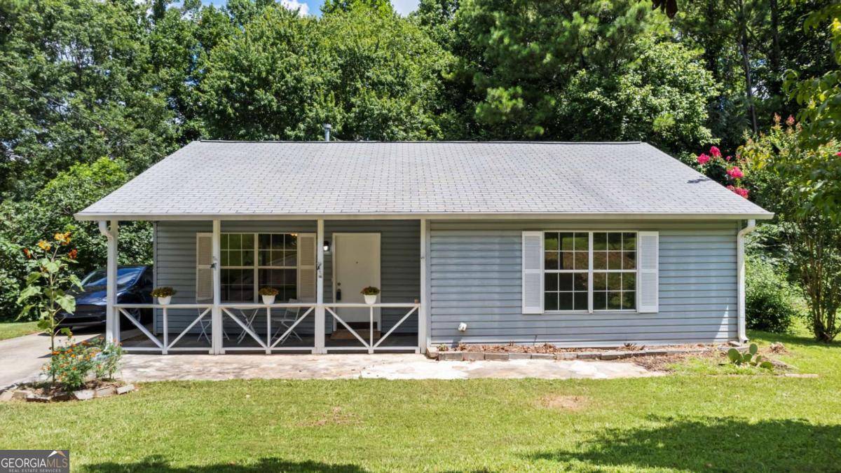 This move-in ready home combines comfort, convenience, and lifestyle in one of the area's most sought-after locations. Perfectly located just steps from Logan Farm Park and within walking distance to historic downtown Acworth. This charming 3-bedroom, 1-bath home enjoys fresh interior paint, brand new LVP flooring throughout, updated vanities, and new appliances in the kitchen. The backyard offers privacy and direct access to the park, making it ideal for outdoor enthusiasts. Plus, you're just a short golf cart ride away from the sandy shores of Acworth Beach.