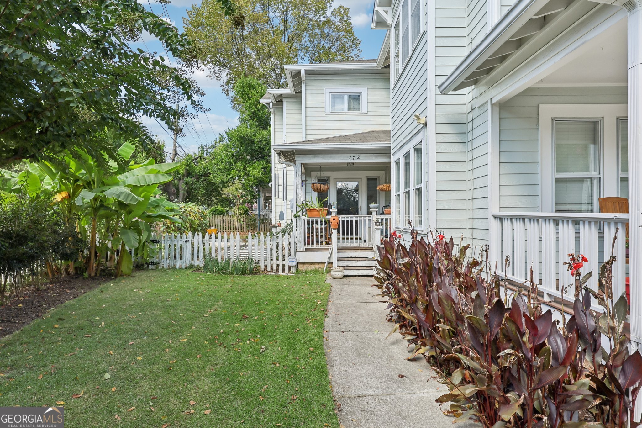 A Candler Park gem where character meets convenience. Minutes from Marta, Inman Park, Little Five Points and the BeltLine, this 3-bedroom, 2.5-bath home blends timeless charm with modern versatility. Located in a top-performing school district, this home gives you a little bit of everything for making the most of Atlanta living. Step inside to find a spacious layout, with all three bedrooms situated upstairs for added privacy. Just off the 2 car garage, you'll discover a large bonus room with a half bath and shower stub, making it an ideal in-law suite, private office or content creation studio. Outdoor living shines here with a small fenced front yard featuring a stone walkway and thriving blueberry, blackberry, and raspberry plants. The larger side and backyard include a fig tree and space for your own vegetable or flower gardens, giving you room to enjoy nature without leaving home. This home truly offers the best of both worlds-an urban retreat that balances connection and calm.