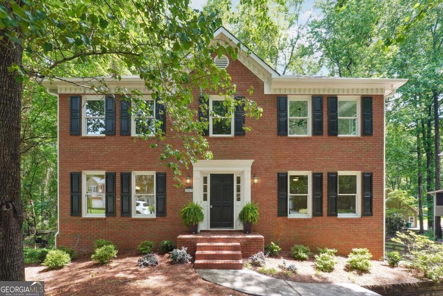 Welcome to this beautiful East Cobb 5-bedroom, 3.5-bathroom home, where modern elegance meets classic charm. This home has been FULLY RENOVATED, including brand-New Windows, New Roof, New main level Furnace, NEW Water Heater, NEW Garage Doors, NEW Flooring throughout, NEW Interior and Exterior paint, NEW Deck, NEW Appliances, NEW Vanities, NEW Tiled bathrooms, NEW Cabinetry in kitchen and all bathrooms. Every corner of this home has been thoughtfully updated to provide comfort, style, and functionality, making it the perfect place for families of all sizes. This expansive 5-bedroom home offers generous living spaces, with an traditional floor plan perfect for entertaining or relaxing with family. The renovated kitchen is a culinary dream, featuring stainless steel appliances, custom cabinetry, Quartz countertops, sunny breakfast room for casual dining with access to expansive deck. The luxurious master suite is a true retreat, featuring a walk-in closet and a spa-like en-suite bathroom with a soaking tub, separate shower, double vanities, and modern fixtures. With 3.5 tastefully renovated bathrooms, you'll appreciate the high-end finishes and attention to detail throughout. The finished basement offers additional bedroom space, full bathroom and sitting area. Access to covered patio and expansive deck for views of the creek. Enjoy your own private oasis with a spacious backyard, ideal for hosting gatherings, playing, or relaxing outdoors. Gorgeous hardwood floors flow throughout the main living areas, while recessed lighting and modern light fixtures create a warm and inviting atmosphere.  FULLY RENOVATED ensuring energy efficiency and long-term durability and peace of mind. Conveniently located near top-rated schools, parks, shopping, and dining, this home offers the best of both convenience and privacy. Don't miss your chance to own this turn-key property in a highly desirable neighborhood. Schedule a showing today!