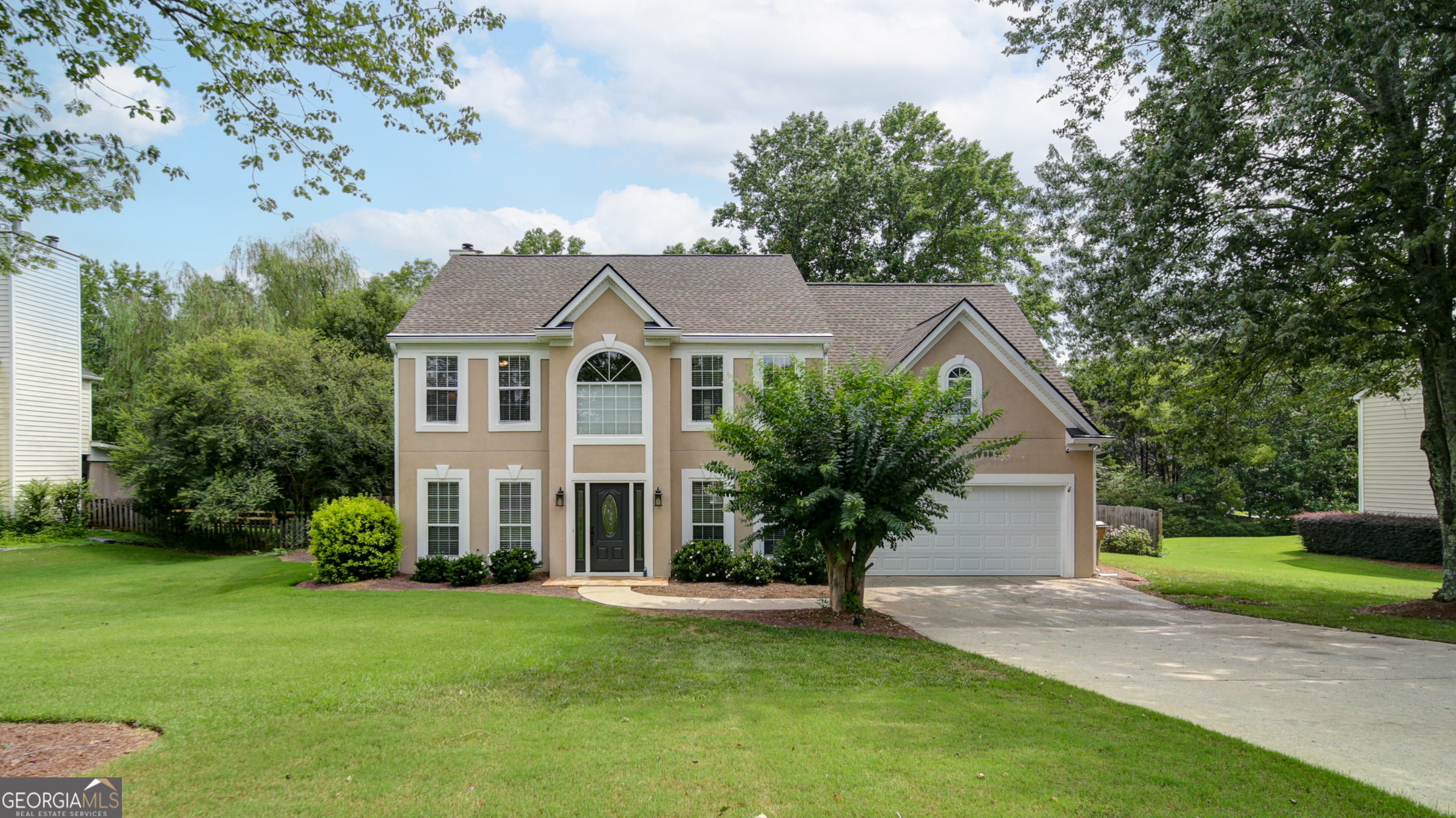 Welcome Home! Enjoy this 4-bedroom, 2.5 bathroom home in the desirable Dressage swim/tennis community located in the Vickery school district. This home features 0.5-acre lot, features an open-concept layout with a gourmet kitchen boasting granite countertops, White cabinets and stainless steel appliances. A large living room with gas fireplace, Hardwood floors throughout the main level. Upstairs you'll find a luxurious master bedroom with an en-suite, and three additional bedrooms. Enjoy a private, fenced backyard with patio and deck, perfect for relaxation. Recent upgrades include new flooring. Located 1 mile from Vickery Village and served by top-rated Forsyth County schools! Too Much To List! Must See!
