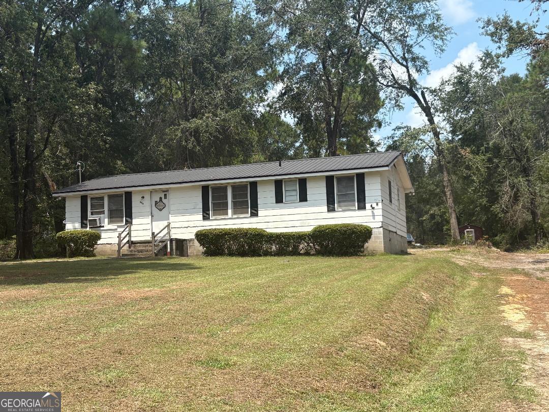 Opportunity awaits on Country Club Road! This 4-bedroom, 2-bath home is situated on 2 acres in a prime location, directly beside Brier Creek Country Club and golf course. With solid bones and classic character, this older home offers plenty of space and endless potential for the right buyer. Renovations and updates will be required, making it ideal for investors or those ready to create their dream property in one of Sylvania's most desirable settings. Enjoy the peaceful surroundings, mature trees, and the convenience of being just steps from golf, while still close to all that Sylvania has to offer. Please note: This property will not qualify for FHA or USDA financing.