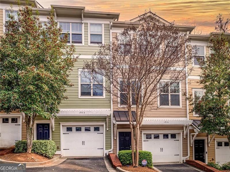 Beautifully maintained 3-bedroom, 3.5-bath townhome in the heart of Brookhaven, offering a versatile floor plan and unbeatable convenience. Freshly painted with updated lighting throughout, this home features a spacious living room with ceiling fan, fireplace, and built-in surround sound-perfect for entertaining or everyday living. The kitchen is equipped with stainless steel appliances (refrigerator included) and opens to a separate dining room with a stylish new light fixture, while large windows provide an abundance of natural light. Upstairs, you'll find two bedrooms including the primary suite with private bath including separate shower and a separate like-new large tub, double closet, and an upstairs laundry closet for added ease. The lower level offers a rare private bedroom suite with full bath-ideal for roommates, guest quarters, a rec room, or home office-with convenient access from the garage. This gated, secure community offers peace of mind in a prime location: walking distance to parks, schools, and shopping, just minutes to I-85, and within close proximity to the new Children's Hospital. Plenty of storage throughout, move-in ready, and available now.