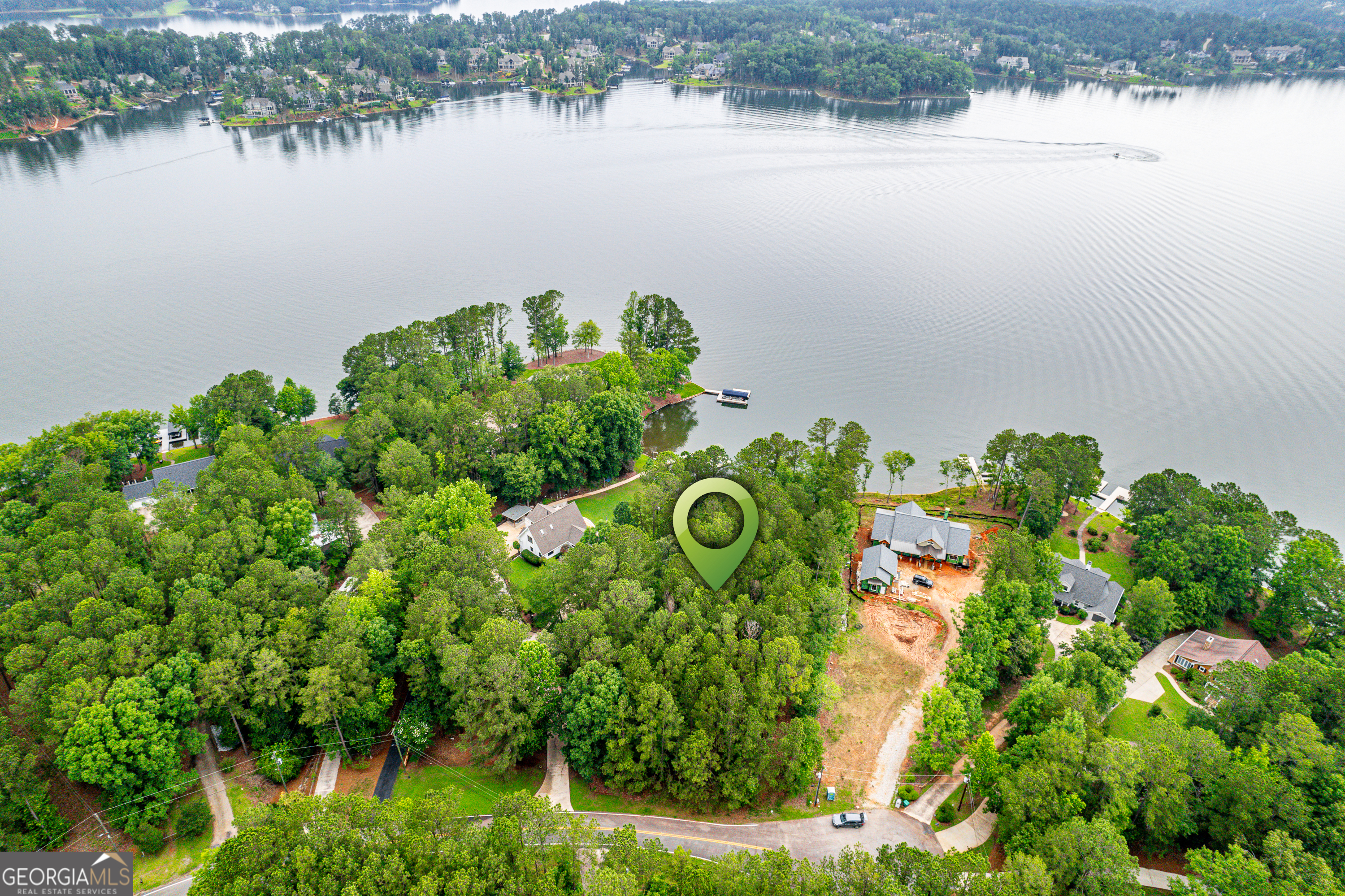 Discover your personal oasis in this enchanting lakefront lot, perfectly positioned to offer breathtaking big water views while nestled in the protected tranquility of a peaceful cove. The gentle slope of this lot lends itself to many types of home plans that will maximize the panoramic views of the shimmering waters of Lake Oconee. Located just across from the coveted Horseshoe Bend area of Reynolds, you will be minutes from some of the best attractions on the lake. From Jumping Rock to the Ritz-Carlton, this homesite puts the best of Lake Oconee at your fingertips.