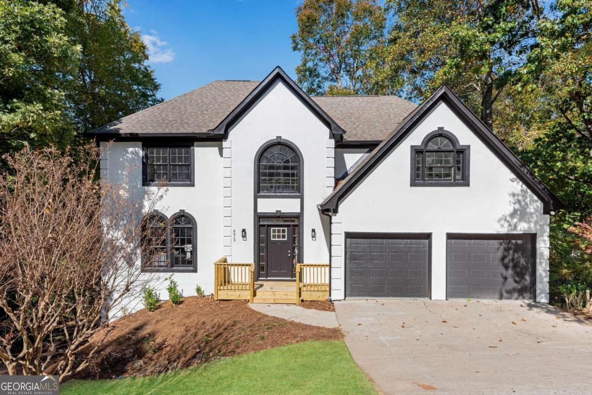 Beautifully renovated traditional style home in Lexington neighborhood with tons of space & designer touches! Step inside to a gorgeous two story entrance foyer w/ light oak hardwood floors throughout! To the left is an open concept formal living room w/ windows allowing for natural light. Living room flows seamlessly into the spacious dining room. Dining connects directly to the remodeled kitchen w/ luxurious finishes featuring white cabinets, sleek SS appliances, and gorgeous white & gray vein quartz countertops with backsplash! Kitchen island has additional storage and is perfect for bar seating. Cozy breakfast room has windows looking out into the wooded backyard. Large family room is open to the kitchen & has a beautiful black brick & shiplap fireplace w/ wood mantle perfect for gathering. Exterior door off family room leads to an oversized party deck that looks out into the trees. Off the kitchen towards the front door is a convenient half bathroom great for guests. Head upstairs to find the stunning oversized primary suite w/ tray ceiling. Barn door opens into the super spacious private bathroom retreat featuring separate vanities w/ tons of space, tiled floors, quartz countertops, free floating soaking tub, large window, separate tiled walk-in shower, & fantastic walk-in closet w/ double doors. Three additional bedrooms upstairs share matching large full hall bathroom. The laundry room is located on the upper floor for added convenience. This home also has a spacious unfinished basement that can cater to any storage needs now or can be finished to your satisfaction in future with both interior & exterior entrances. Backyard is extremely low maintenance for those with busy schedules! This home is complete w/ new HVAC, entire interior & exterior freshly painted, new light fixtures & fans, new carpet in bedrooms, new tiled wet area, & the roof is only about 5 years old.