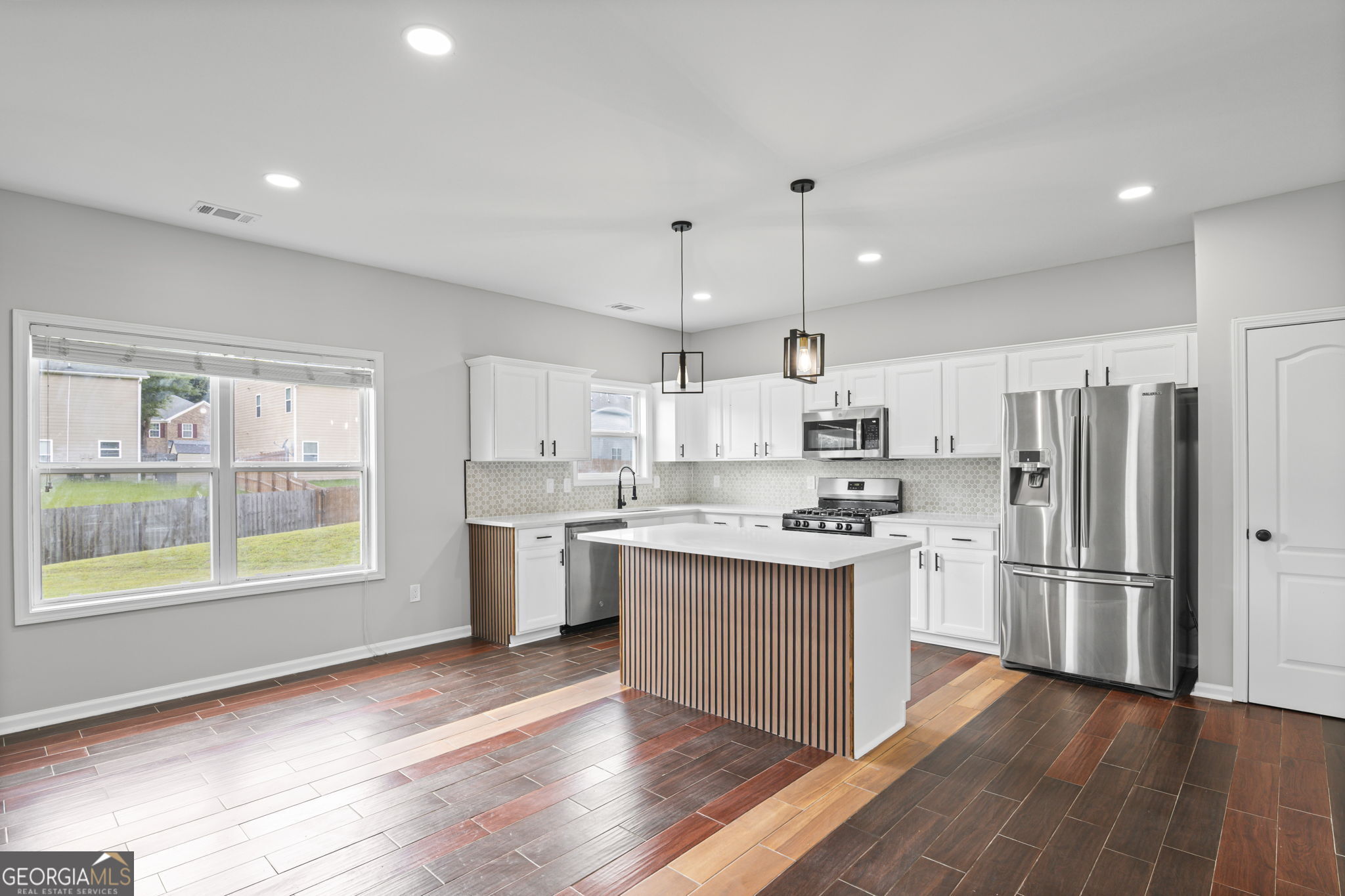 Eligible for 100% Financing with No PMI! Welcome to 6974 Chilkat Ct SW, a beautifully renovated 4-bedroom, 3-bathroom home that combines modern upgrades with timeless charm in one of Atlanta's most desirable communities. Step inside to find an expansive master suite with a private sitting area, three additional oversized bedrooms, plus a full bedroom and bath on the main level-perfect for guests or multi-generational living. The open layout is enhanced with gleaming hardwood floors throughout (no carpet!), fresh interior and exterior paint, and a versatile upstairs loft ideal for a home office, playroom, or media space. Major upgrades ensure peace of mind, including two brand-new HVAC systems, updated plumbing and electrical systems, and a newly refreshed interior that feels move-in ready. Outdoors, enjoy a covered back patio overlooking the backyard, an inviting space for relaxing or entertaining. As a resident, you'll also have access to resort-style amenities-a clubhouse, sparkling pool, tennis courts, playground, and picnic areas-making this home as much about lifestyle as it is about comfort. Don't miss this opportunity to own a fully updated home in a prime location with outstanding community features. Schedule your showing today and see why this is more than just a house-it's your next home.