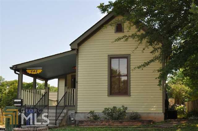 Amazing home in historic Grant Park. Unique tongue & groove ceilings and walls, hardwood floors, entry foyer, and relaxing front porch. Renovated kitchen includes stone countertops, island, plenty of work space, and all appliances. Farm table dining area. 2 oversized bedrooms each with private bath. OFF STREET parking via alley off Cameron St. Excellent condition with many upgrades including spray foam insulation, 1/2 bath space, laundry closet, outdoor storage, and more!
