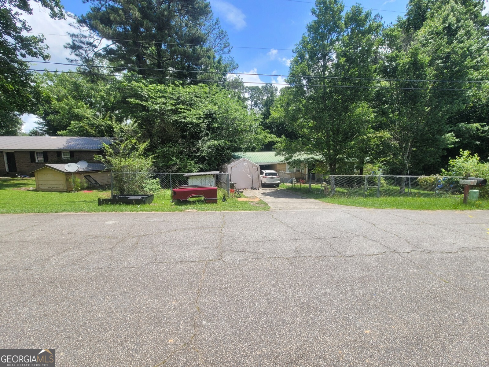 Charming home on a spacious lot less than an acre with chain-link fencing. Features updated PVC plumbing and a metal roof with a lifetime warranty (installed 2010). Kitchen and bath offer resilient flooring. Comfortable layout with Formica and laminate surfaces.