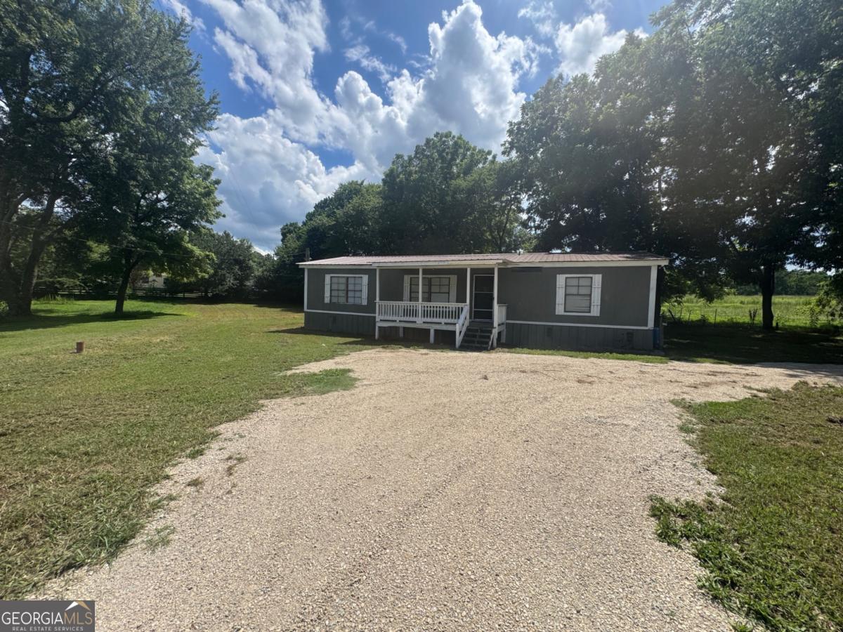 CHEAPER THAN RENT. Large Doublewide on Level Lot. 3 Bedroom / 2 Full Baths. New HVAC, New Flooring, Fireplace, Metal Roof. Call Today!