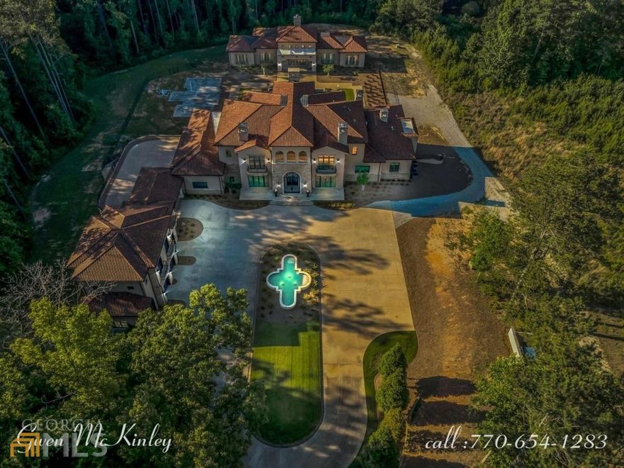 Gated Main Entry. English Manor Full finished basement, 8 garage 1 Boat/ATV, Pool House, Carriage House, 15.04 acres, w/stocked lake, Exclusive estate feature main foyer spectacular curved staircase, barrel ceiling, Formal living & dining rooms, 2 FPs, Oversized windows, natural light, slate roof, copper gutters, Master Suite, morning bar main level, his & her closets, dressing rm, Elevator, Grand foyer, parlor, Gourmet Kitchen, Butler Kitchen, Terrace level w/entertainment rom, FP, oversized bar, Theater, bedroom.