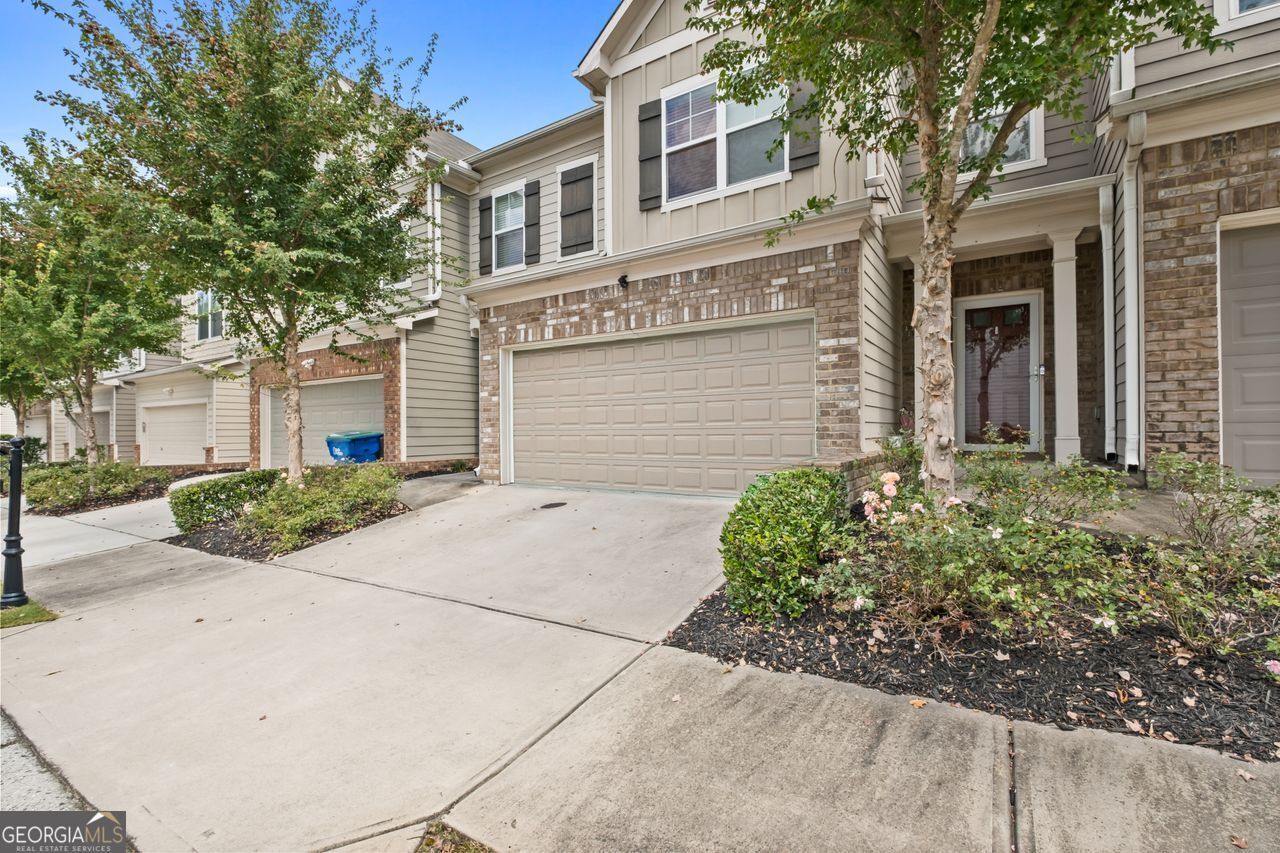 Welcome to Cascade Place! This charming 3-bedroom, 2.5-bath townhome offers an open and spacious floor plan designed for modern living. The bright family room with a cozy fireplace flows seamlessly into the stylish kitchen, complete with a large island, stainless steel appliances, and plenty of space for entertaining. Upstairs, the owner's suite features a double vanity, soaking tub, and separate shower, with two additional bedrooms and a convenient laundry room nearby. Built in 2017, this home also includes a two-car garage, high ceilings, and thoughtful finishes throughout. Perfectly located just minutes from Camp Creek Marketplace with easy access to I-20 and I-285, you'll enjoy both comfort and convenience in one of Atlanta's most desirable spots.
