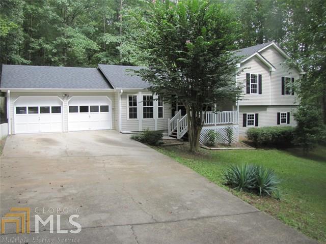 EXCELLENT SPLIT LEVEL HOME WITH 4 BEDROOM & 3 FULL BATHS IN PRIVATE & WOODED SETTING, NEW CARPET, NEW FLOOR VINYL, NEW HEAT & AIR SYSTEM, NEWLY PAINTED, OPEN FAMILY ROOM WITH NEW CARPET + CATHERIAL CEILING + FIREPLACE; LARGE KITCHEN WITH BREAKFAST AREA + NEW STAINLESS APPLIANCES + NEW VINYL FLOORING; COUNTRY FRONT PORCH; UPPER LEVEL WITH MASTER BEDROOM WITH TREY CEILING + LARGE CLOSIT; MASTER BATH WITH GARDEN TUB & SHOWER; LOWER LEVEL WITH BONUS ROOM + UTILITY ROOM + BEDROOM & FULL BATH; 4 BEDROOMS 3 FULL BATHS DOUBLE GARAGE WITH PAINTED FLOOR; TWO LOTS,APPROX 3.9 ACRES WOODED & PRIVATE FENCE-IN BACK YARD ....MUST SEE !!!!