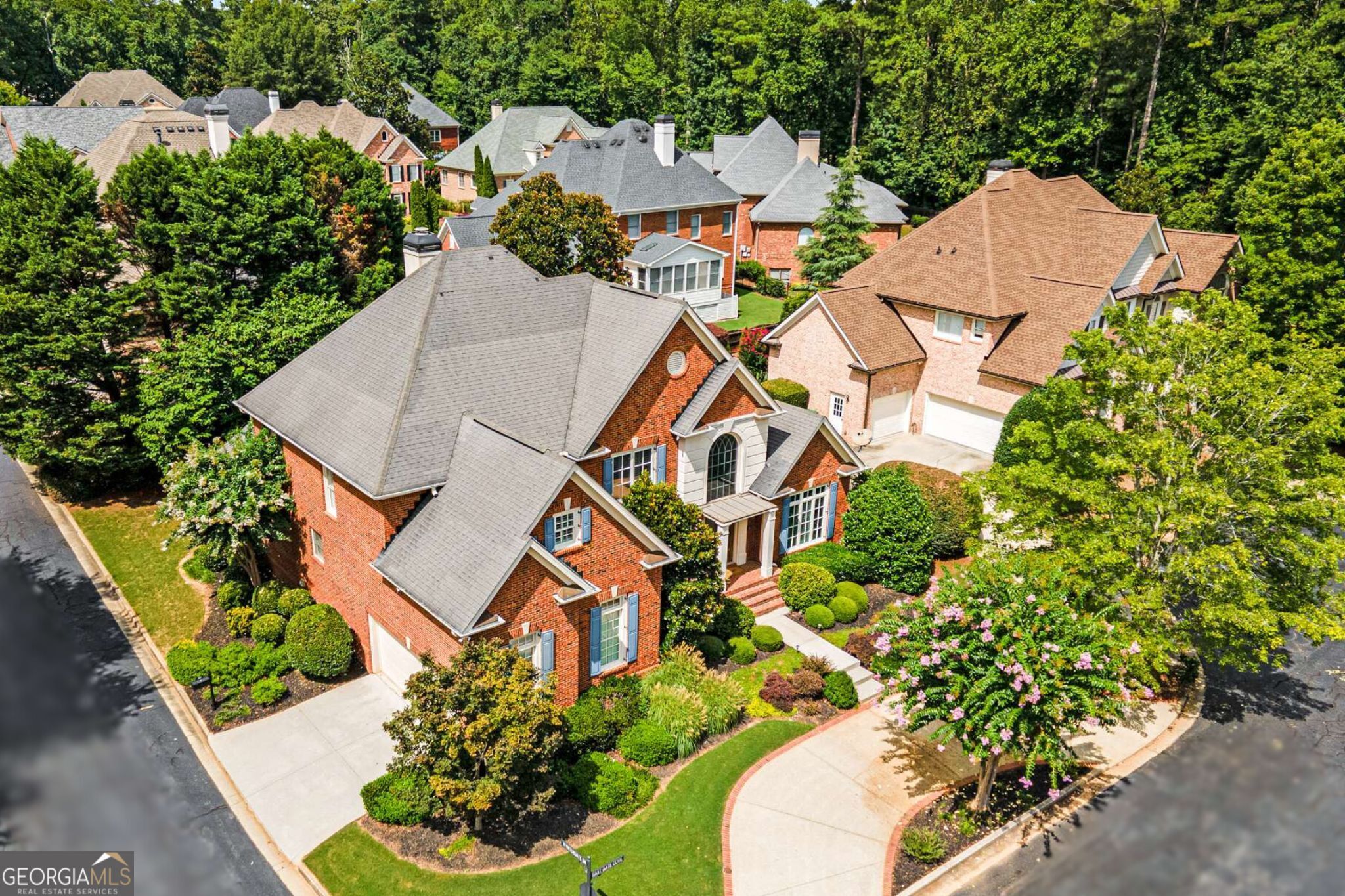 Step into timeless elegance at this stunning 4-sided brick home in the highly sought after gated Wyntergate community, one of Dunwoody's few private enclaves. Custom-built by John Willis Homes, this 5-bedroom, 3.5-bath residence offers 3,508 square feet of curated luxury and thoughtful upgrades. The heart of the home is the beautifully renovated chef's kitchen, timeless with its abundant solid wood cabinets, extended Silestone island, stainless steel appliances, and a cozy stone fireplace that anchors the space. Whether you're hosting or relaxing, the open concept design flows seamlessly into the 2 story great room with a striking marble fireplace and plantation shutters throughout. The sought after owner's suite on the main level offers a serene retreat, with double vanities, a separate tiled shower, and a jetted Jacuzzi tub. Upstairs, you'll find additional spacious bedrooms, perfect for flexible living. Step outside to your private oasis featuring a self-cleaning pool and spa that's always guest ready. The home is packed with upgrades that deliver comfort, efficiency, and style from a tankless water heater and Rachio controlled irrigation system with a separate meter, to sprayed attic insulation for energy efficiency, a concrete crawl space floor, and Pella windows. Smart living is built in with a Lutron system, Garage Tek storage, and more. Every detail has been considered - even down to the plantation shutters and professionally maintained exterior. Wyntergate offers the best of both worlds - luxury living in a gated setting, just minutes from top-rated Vanderlyn Elementary and Dunwoody High, as well as premier dining, shopping, and major highways for easy access across the metro and to the airport. This is more than a home - it's a lifestyle. Come see what sets this home apart.