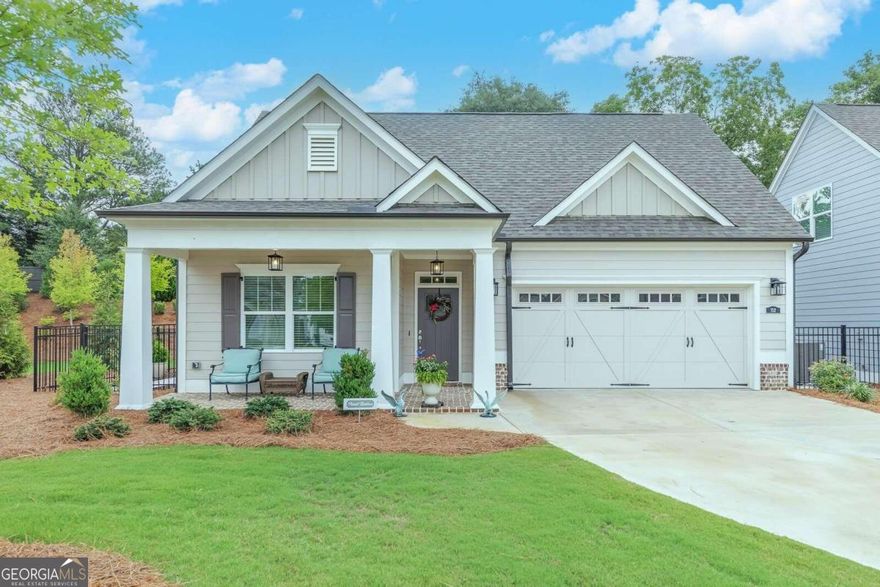 Welcome to 152 Owenby Commons, nestled in the charming community of Owenby, built by Windsong Properties. This inviting home is the Ashford plan with an additional sunroom and offers a harmonious blend of comfort and style, perfect for both relaxation and entertaining. As you step inside, you'll be greeted by a spacious and open floor plan that seamlessly connects the living areas. The modern kitchen features sleek countertops, ample cabinetry, a walk-in pantry, and high-end appliances, making it a chefCOs dream. The adjacent dining and living areas are bathed in natural light, creating a warm and welcoming    atmosphere. The sunroom overlooks the peaceful courtyard and provides easy access for grilling and relaxing. The master suite is a serene retreat, complete with a generously sized bedroom, a walk-in closet, and a luxurious en-suite bathroom with double vanities and a step-less walk-in shower. Additional bedrooms are thoughtfully designed to provide comfort and privacy for family or guests. The upper level features a large bonus room and a full bath. Situated in an active adult neighborhood, the community features a clubhouse offering a grand room, catering kitchen, and covered rear porch. HOA maintains the landscaping allowing you time to enjoy the surrounding area. Just 3 miles from Downtown Woodstock, Owenby provides convenient access to local amenities, shopping, dining, and parks.