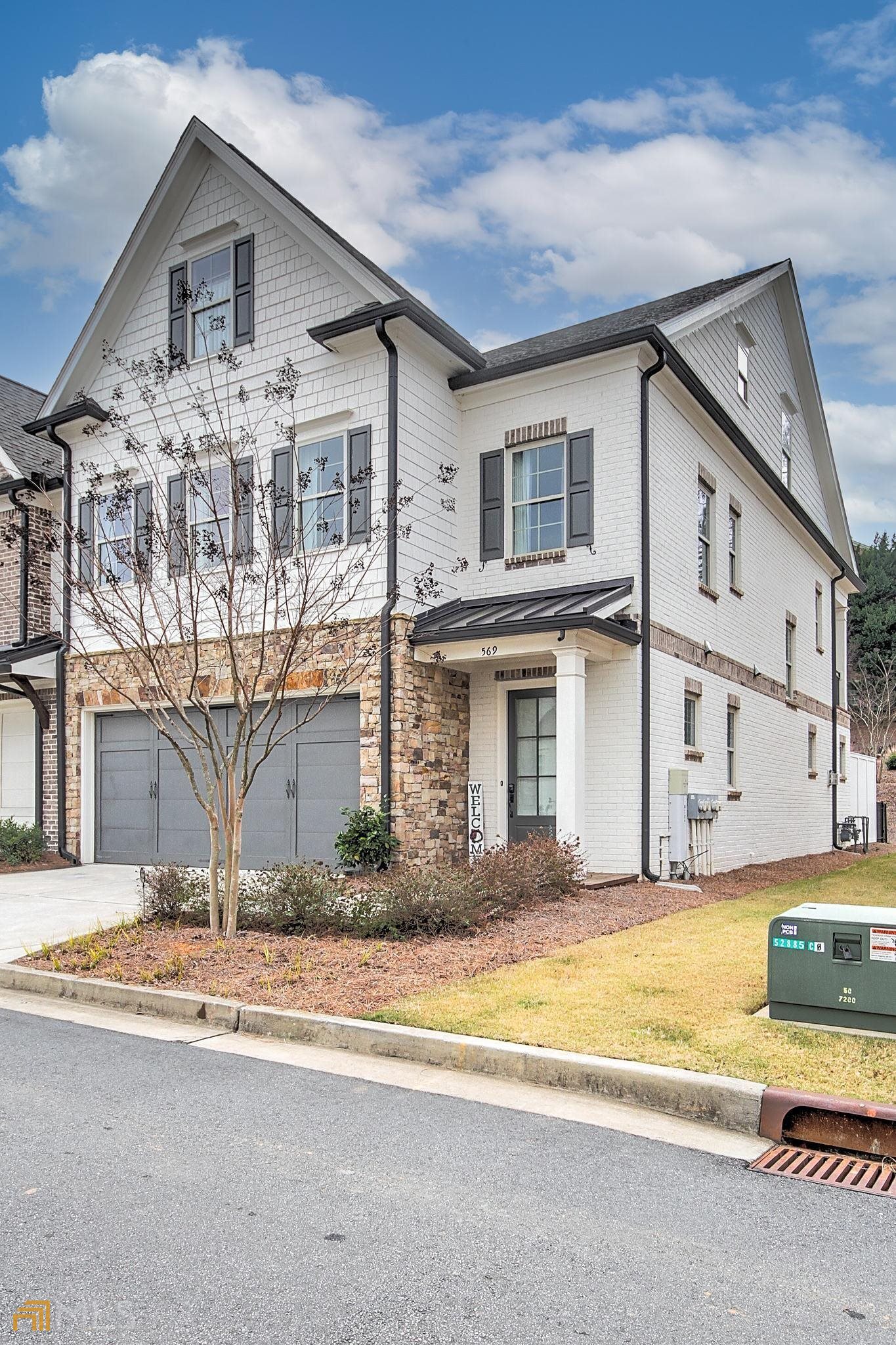 Your Search Is Over! Designer's Dream 4 Bedrooms, 3.5 Baths, 3-Story END UNIT Townhome (with ELEVATOR!) Located Within Walking Distance Of Kennesaw Mountain National Battlefield Park & Its Miles Of Walking Trails. Minutes to I-75 and the Marietta Square! This Fantastic Home Has Too Many Upgrades To List! 3-Sided Brick End-Unit Home Has 3 Stories, 2 Car Garage, Open Concept Main Level With Huge Kitchen Island, 2 PANTRIES WITH CUSTOM BUILT IN SHELVING (1 walk-in), FORMAL DINING ROOM & Fireside Family Room With Built-In BOOKCASES ON EACH SIDE OF FIREPLACE, Butler's Pantry & WINE FRIDGE, Leading Out To Back Stone Patio Living. Take The Elevator - Yes, ELEVATOR - Up To The 2nd Floor With A Spa-Like Owner's Retreat Featuring An Oversized Ensuite With Dual Vanities, Oversized TILED WALK-IN SHOWER, FREESTANDING SOAKER TUB, BALCONY OFF MASTER & WALK-IN Owner's Closet. 2nd Floor Rounded Out With 2 More Oversized Bedrooms w/WALK-IN CLOSETS & A Full Bath and Spacious LAUNDRY ROOM WITH SINK & Storage Cabinets! Hop On The ELEVATOR Again Up To The 3rd Floor Entertainment Area With KITCHENETTE AND WET BAR, Another Bedroom/Gym/Office (your choice), and Full Bathroom. All This With Ample Attic Storage & Oversized Closet Storage On All Levels. Leave Your Car In The Spacious 2-Car Garage & Walk Up To The On-Site Restaurant (Basecamp) For Brunch. KENNESAW MOUNTIAN AND Just 2.5 Miles To HISTORIC DOWNTOWN MARIETTA SQUARE Makes This An IDEAL Location. Do Not Miss Out On This One!
