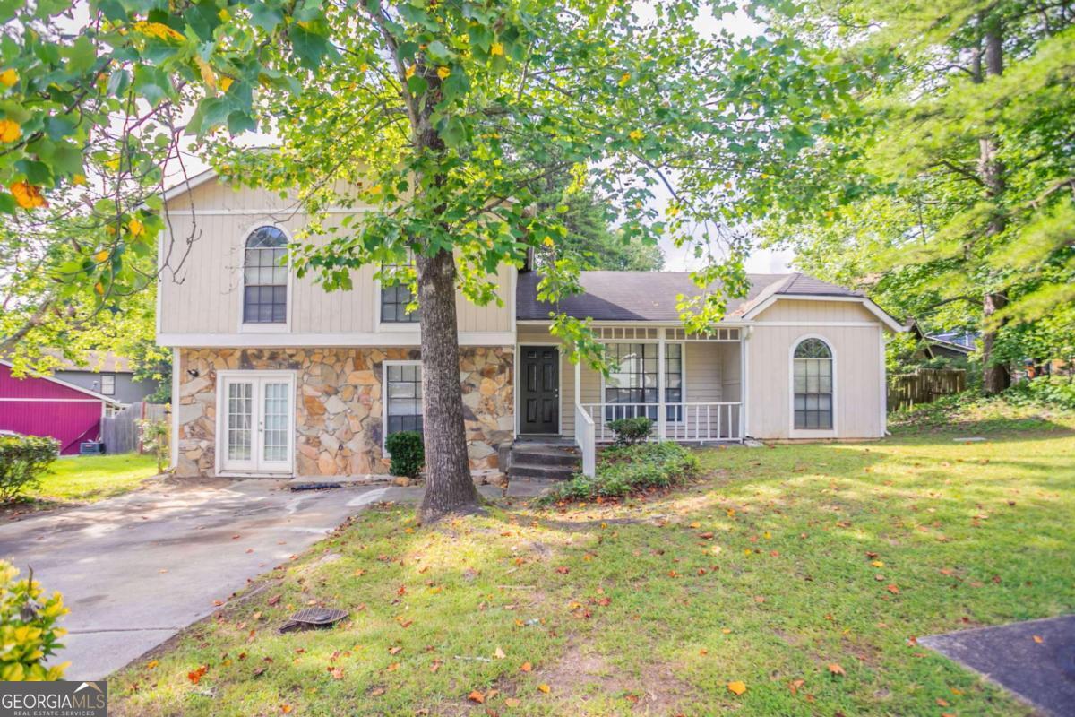 Welcome to this spacious and charming split-level home in the quiet Biffle Downs community. This 3-bedroom, 2-bath residence offers fresh interior paint, wood laminate floors, and vaulted ceilings that bring an open and airy feel to the family room. A decorative fireplace adds a cozy touch, while the bonus room downstairs is perfect for a playroom, office, or flex space. The primary suite features a private bath, and all bedrooms are conveniently located on the upper level. Enjoy relaxing on the rocking chair front porch or entertain guests on the rear deck overlooking a fenced backyard. This home combines comfort, privacy, and space-all within minutes of shopping, dining, and major highways.