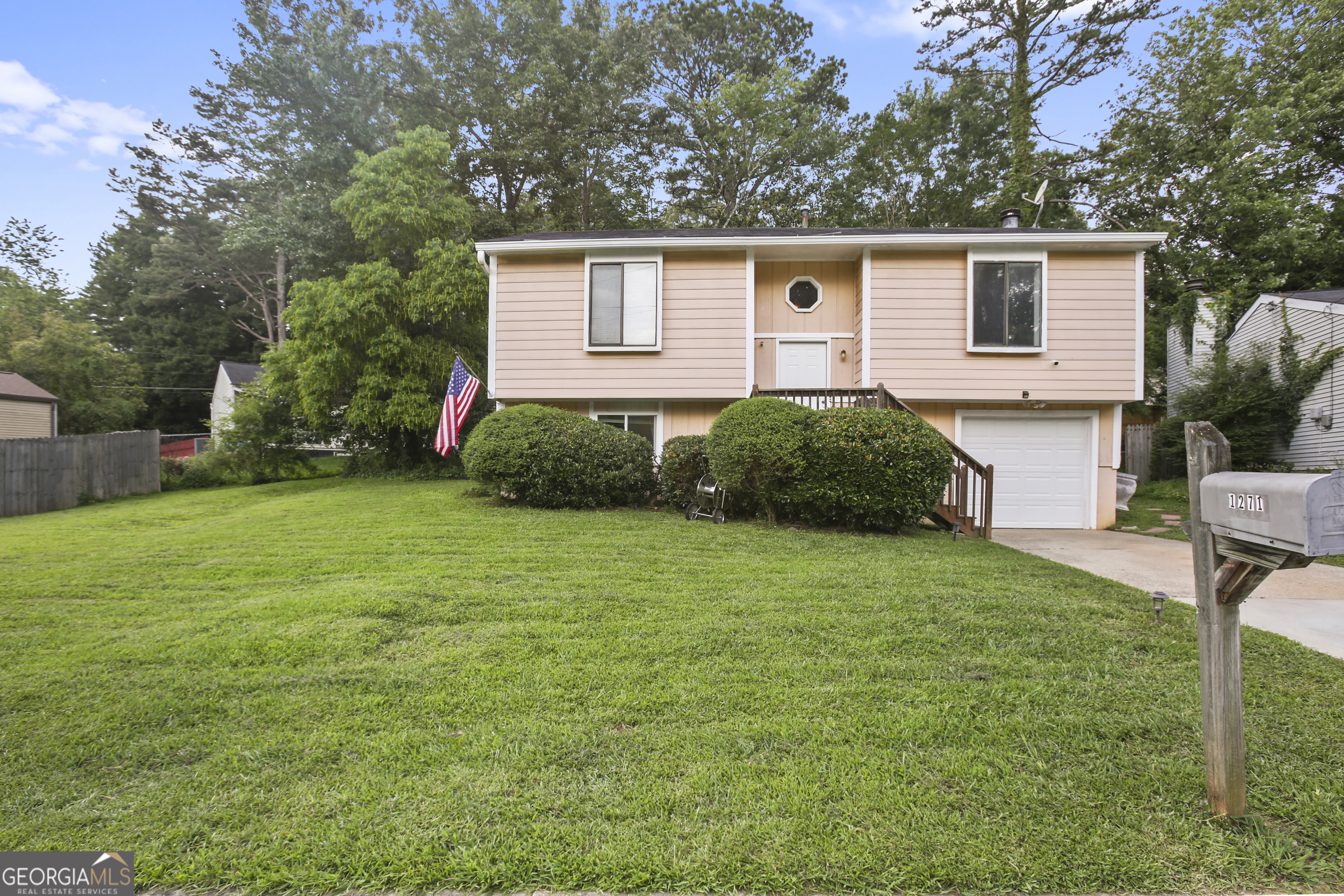 Welcome to this split level home in Stone Mountain. With recently replaced flooring (2023) this home offers carpet free living. The split level layout boasts 4 bedrooms and 2 full bathrooms. Upstairs, you'll find 2 generously sized bedrooms and one full bathroom, a spacious eat in kitchen with access to the deck. The living room offers space for gathering and a charming stone, fireplace. The lower level offers two private bedrooms and an additional bathroom. Located on a quiet street in Muirfield with a reasonably sized yard, this home presents opportunities for just about anyone; from first time home buyers to multigenerational families and investors seeking a solid rental opportunity. With close proximity to grocery stores, shopping Stone Mountain Park and I-285--access is not a problem. Schedule a showing today! Public records reflect 1562 square feet and does not reflect the square footage of the fourth bedroom.
