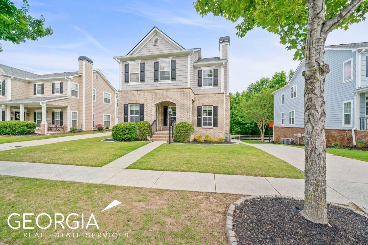 Welcome to this stunning 3-bedroom house located in Suwanee Station. This home has been thoughtfully updated and boasts an array of improvements that are sure to impress even the most discerning homebuyer. As you step inside, you'll immediately notice the attention to detail. The spacious great room welcomes you. Large windows allow natural light to flood the space. A cozy fireplace serves as a focal point, creating an ideal spot for relaxation and gatherings. The gourmet kitchen is a chef's dream, featuring high-end stainless steel appliances, granite countertops, ample cabinetry, and a convenient breakfast bar. It provides the perfect setting for preparing delicious meals while interacting with family and friends. The adjacent dining area offers plenty of space for a large dining table, making it ideal for formal dinners or casual family meals. One of the highlights of this home is the master suite, conveniently located on the main level for added privacy and convenience. This tranquil retreat features a spacious walk-in closet, and a luxurious en-suite bathroom complete with a double sized separate shower, and dual vanities. The upper level of the house is home to two additional well-appointed bedrooms, each with its own walk in closet and large windows that provide abundant natural light. A shared full bathroom on this level ensures comfort and convenience for family members or guests. While the interior of the house is undoubtedly impressive, the unfinished basement presents an exciting opportunity for customization and expansion. Whether you envision a home theater, a gym, or additional living space, the unfinished basement offers a blank canvas for your creative ideas. Outside, the property is equally captivating. HOA keeps a well-maintained yard which creates a picturesque setting. A spacious deck off the main level provides an ideal space for outdoor dining or simply enjoying the peaceful surroundings. This house is situated in a highly sought-after subdivision known for its amenities as well as it's friendly community atmosphere, and convenient location. This 3-bedroom house offers a wealth of improvements, a master suite on the main level and an unfinished basement that presents endless possibilities. Combine these features with the desirable Suwanee location, and you have the perfect place to create lasting memories and call home.